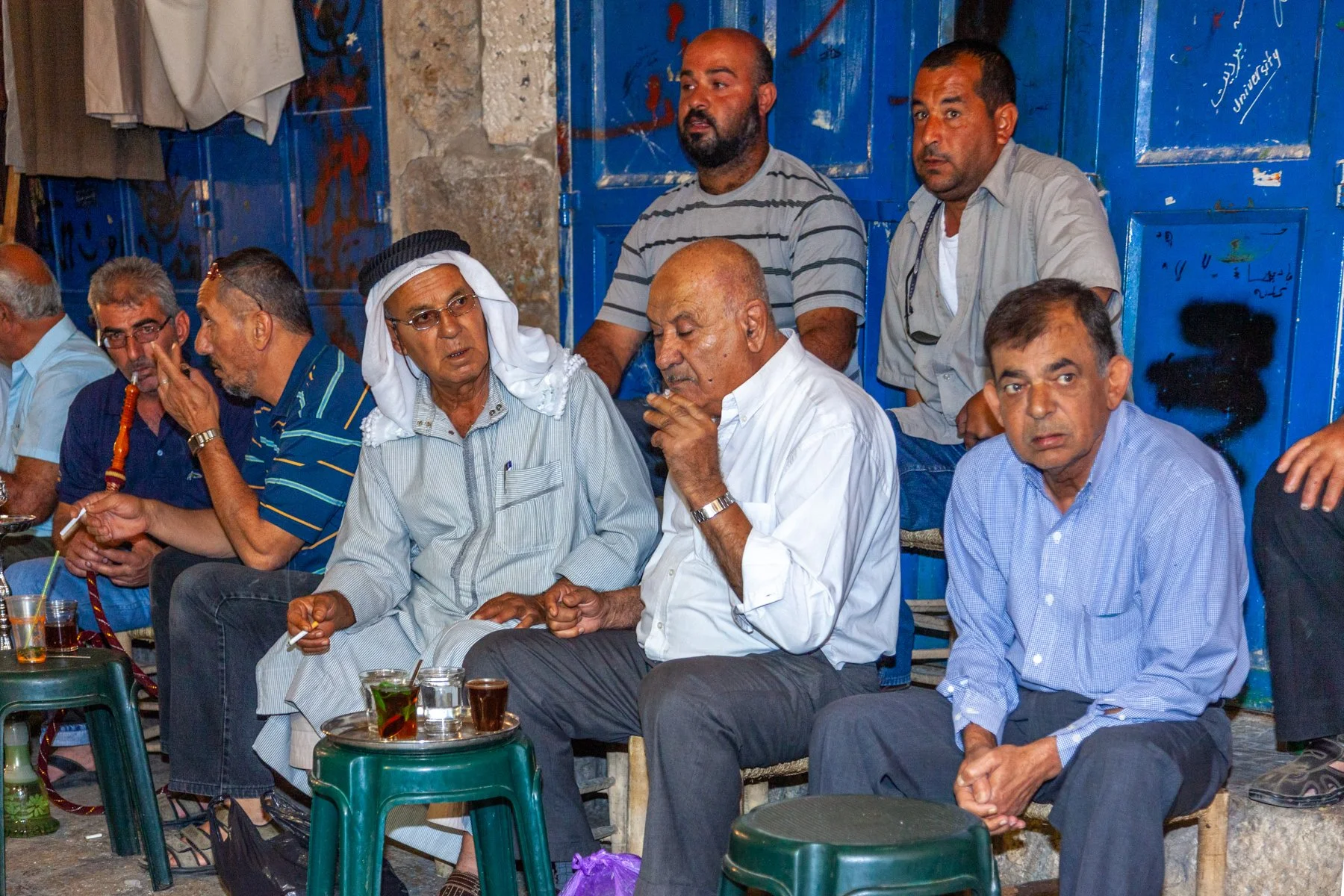 Men gathered outside a neighborhood café in Jerusalem’s Old City.