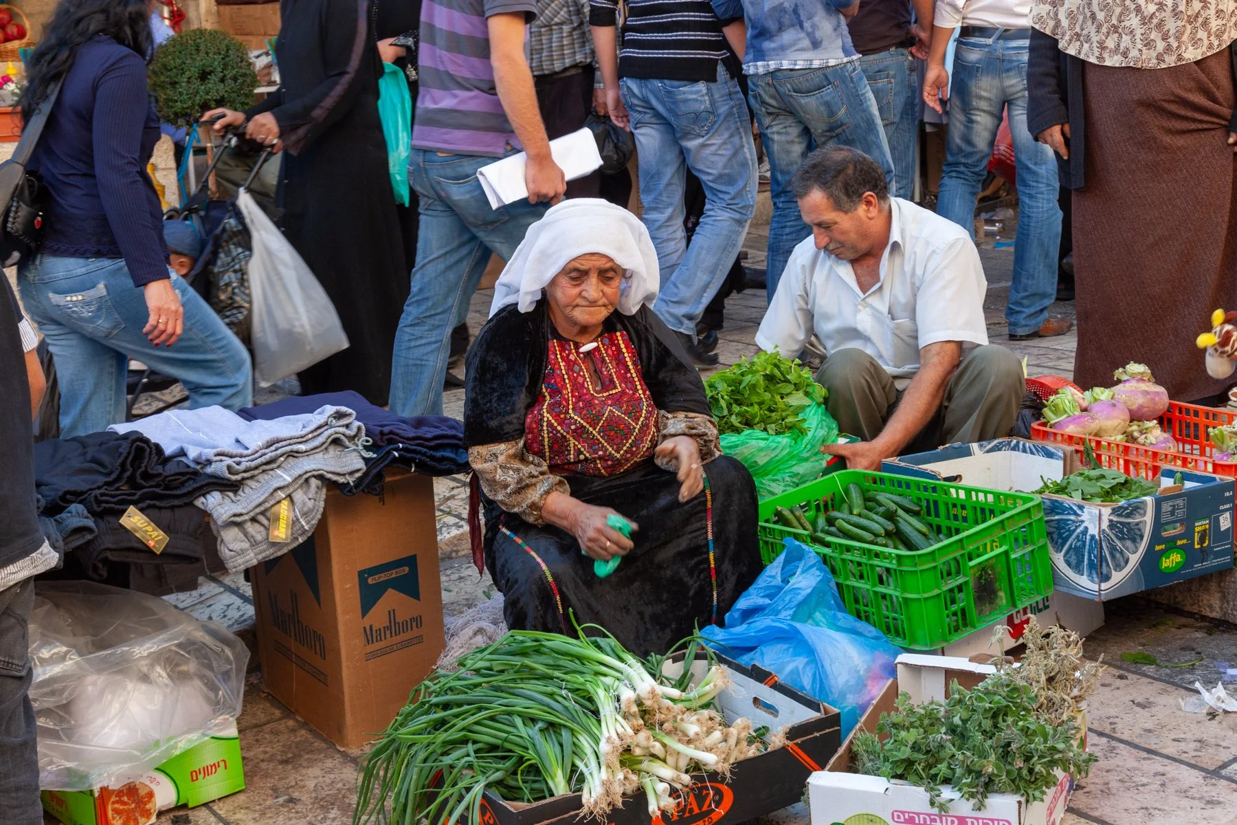 Elderly woman selling vegetables at a street market in Jerusalem’s Old City.