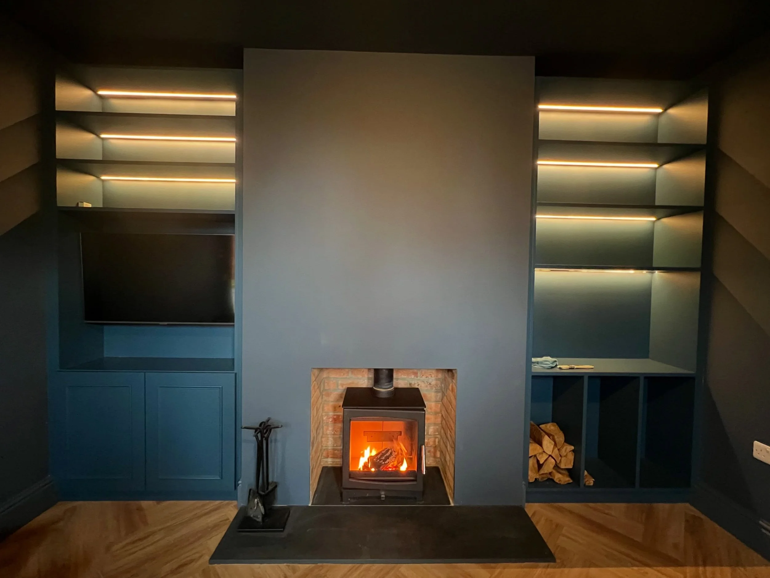 Bespoke storage, open shelving with integrated lighting and a woodburner installation&mdash;bringing warmth and practicality to the heart of the home. 🔥 🪵