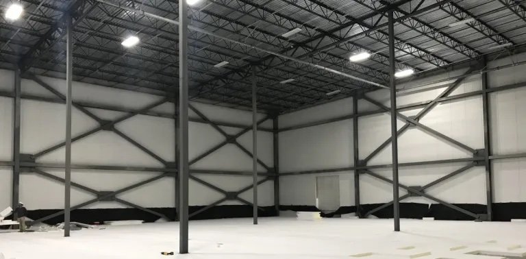 inside an empty cold storage warehouse by Plump Engineering, Inc