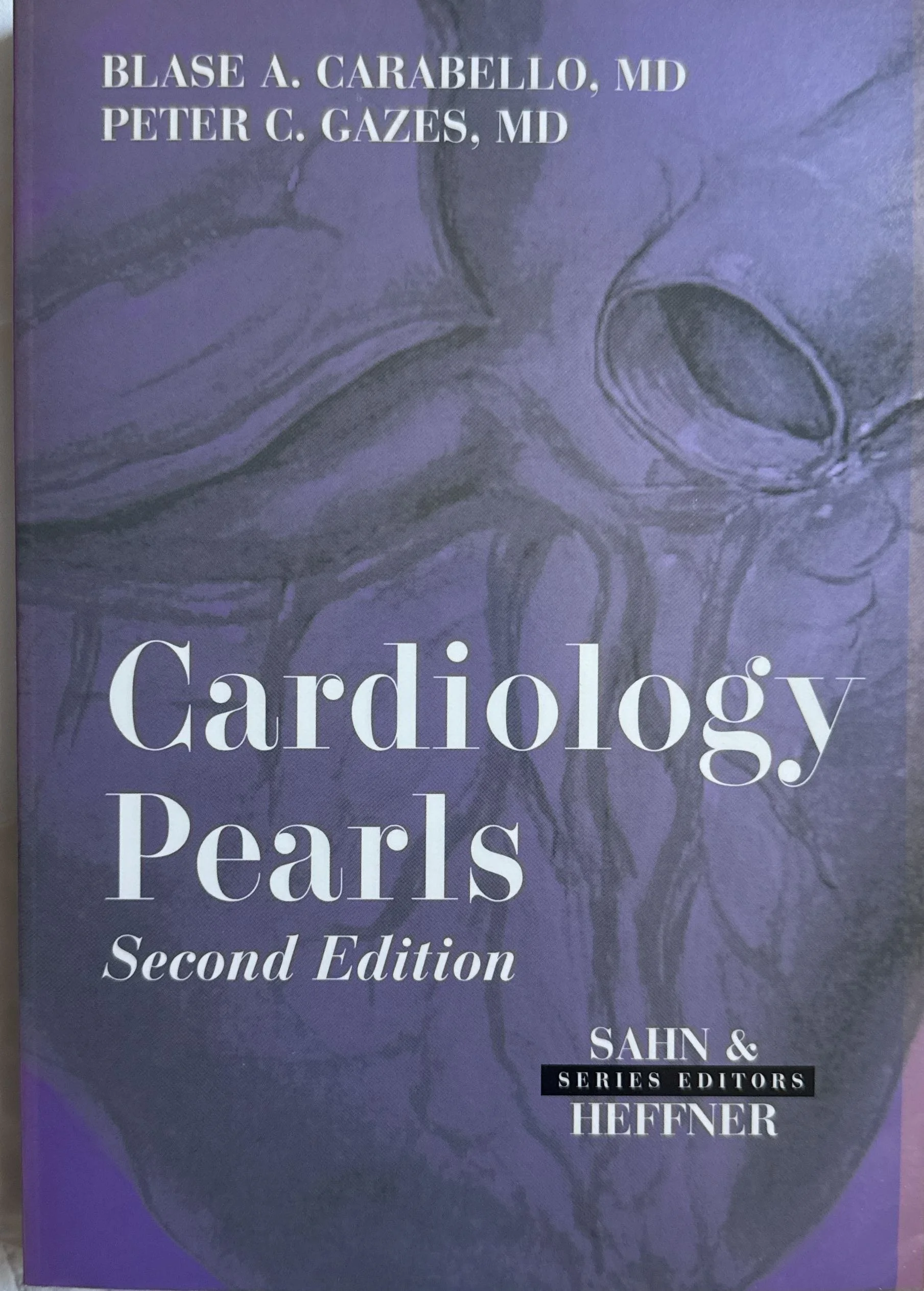 Cover of a medical textbook titled "Cardiology, Second Edition" with authors' names Blase A. Carabello, MD and Peter C. Gazes, MD at the top, and editors' names Sahn and Heffner at the bottom.