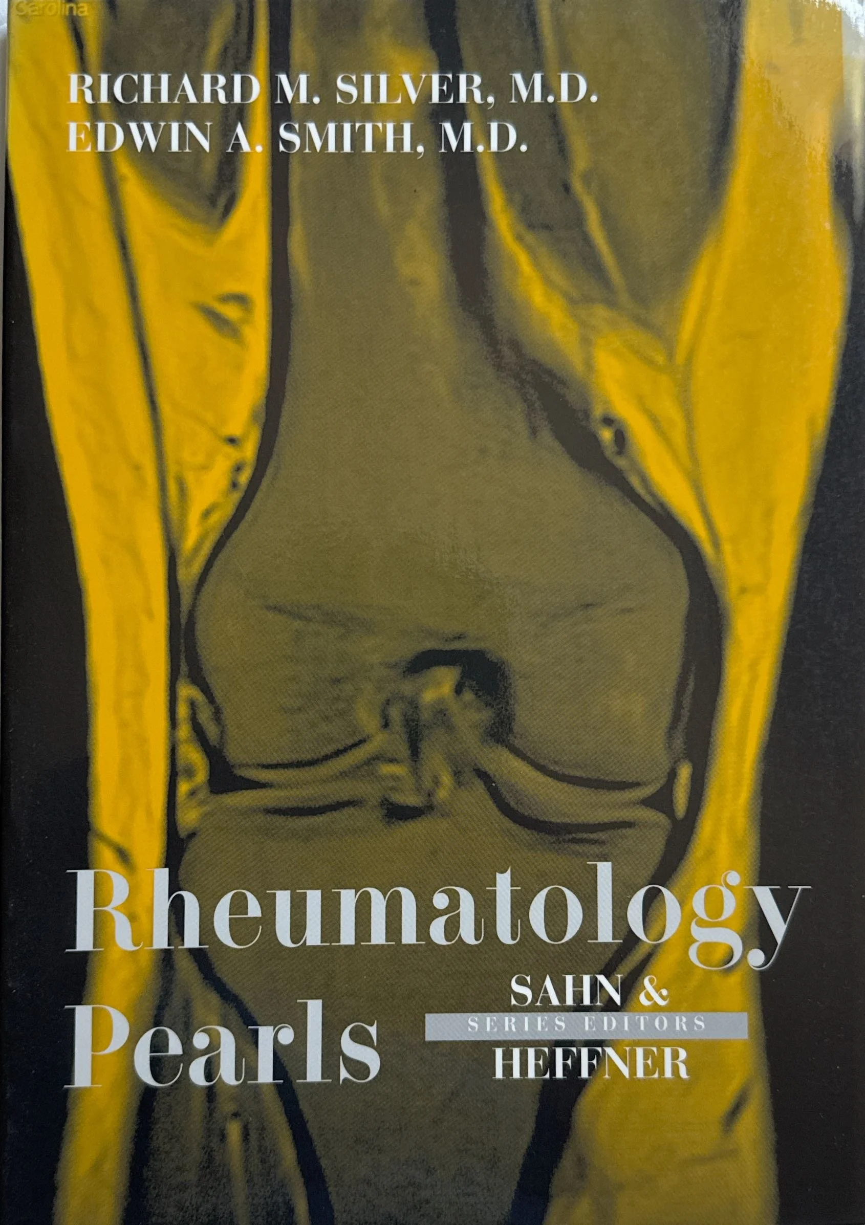 Book cover titled 'Rheumatology Pearls' by authors Richard M. Silver, M.D., Edwin A. Smith, M.D., and Sahn, Heffner. The cover features a stylized medical illustration in yellow and black.