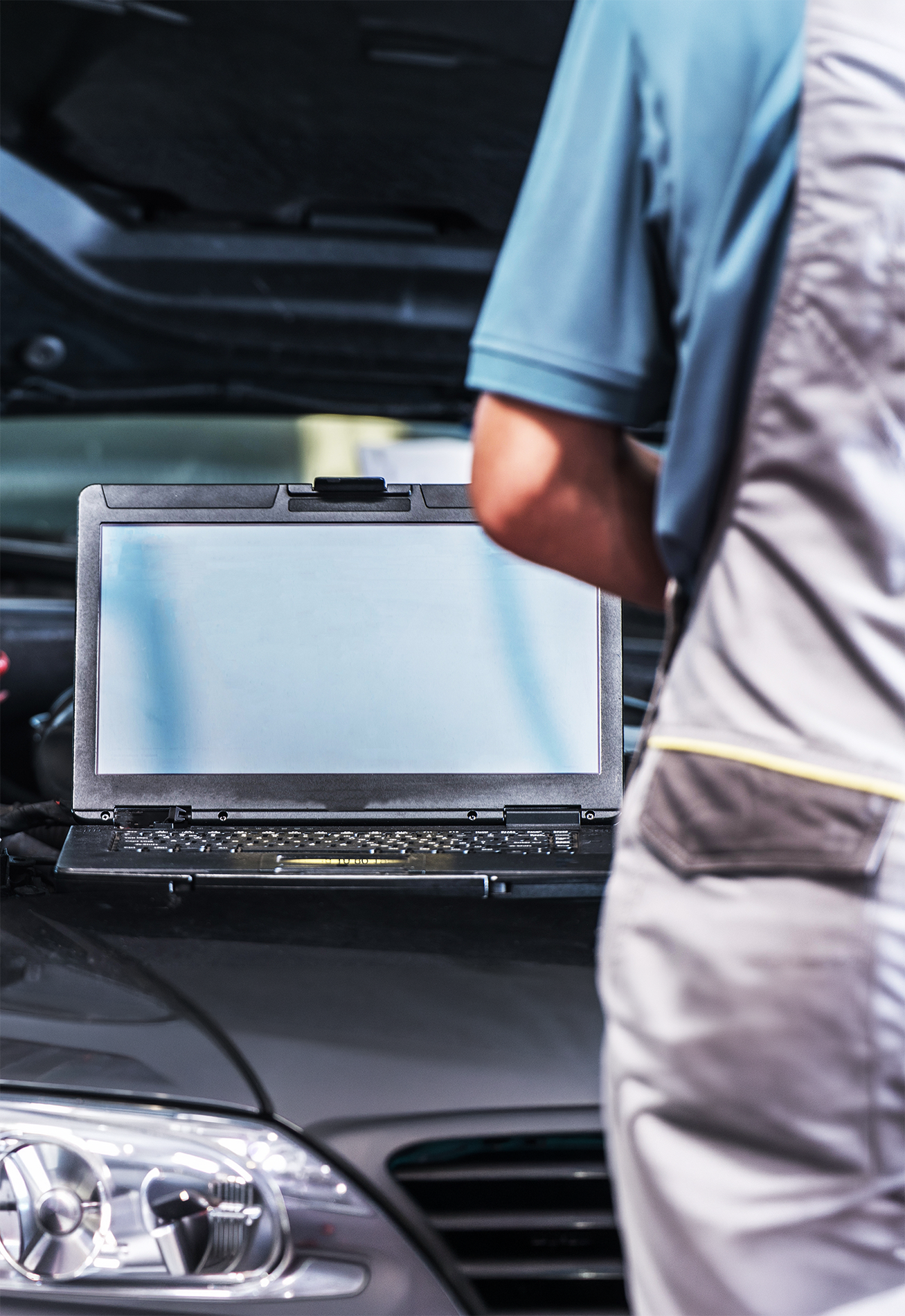 laptop on a car hood