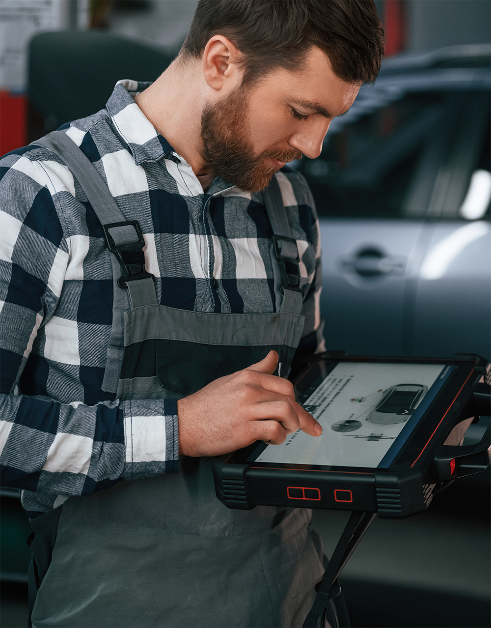 man looking at a scan tool