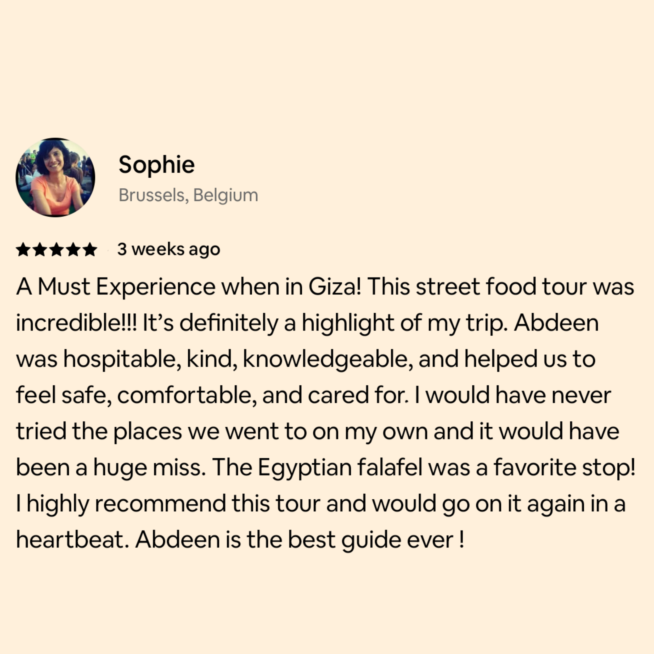 Screenshot of a review by Sophie from Brussels, Belgium, describing her experience on a street food tour in Giza. The review mentions the tour's highlights, Egyptian falafel, and her high recommendation to go again.