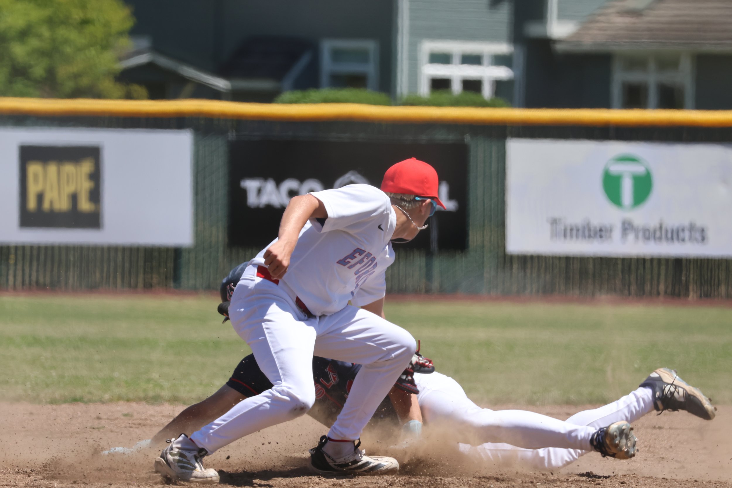 Luca Bartolucci tags a runner out while playing shorstop.