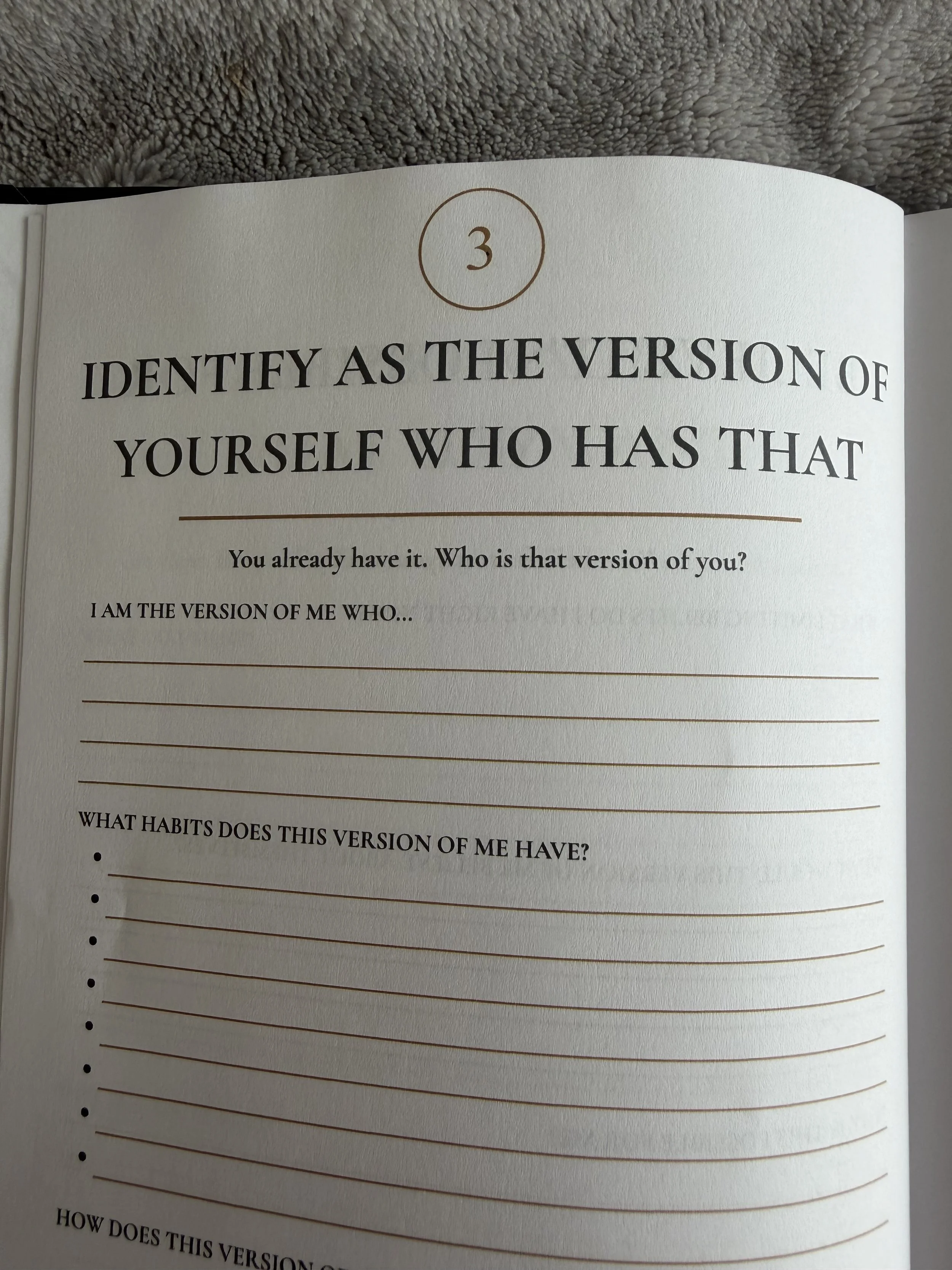 Page from a journal with the chapter numbered 3, titled "Identify as the version of yourself who has that." The page contains a prompt asking the reader who their version is and has lines for writing a response.
