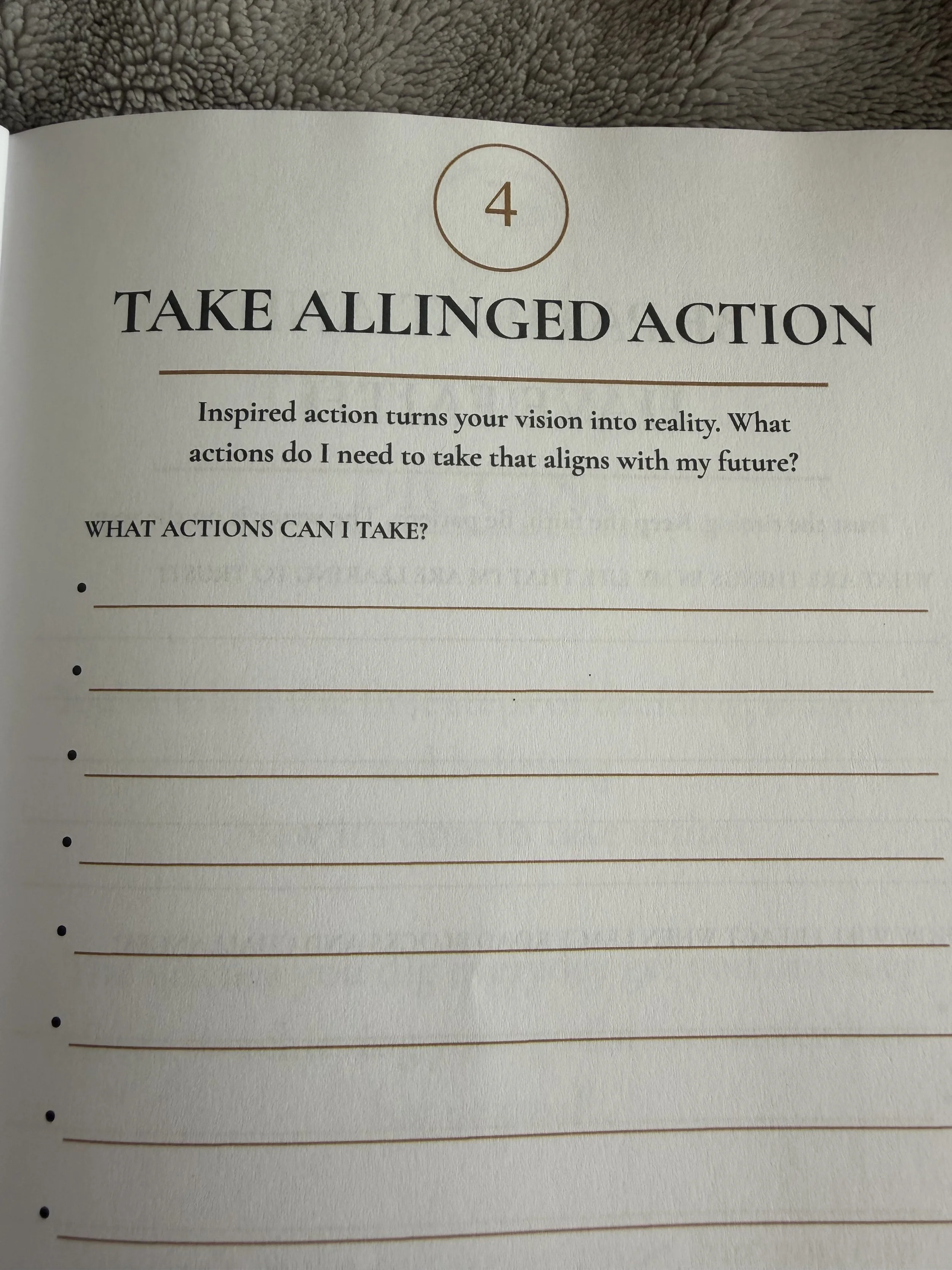 Page from a journal with a section titled 'Take Alligned Action' and a paragraph about turning vision into reality through inspired actions.