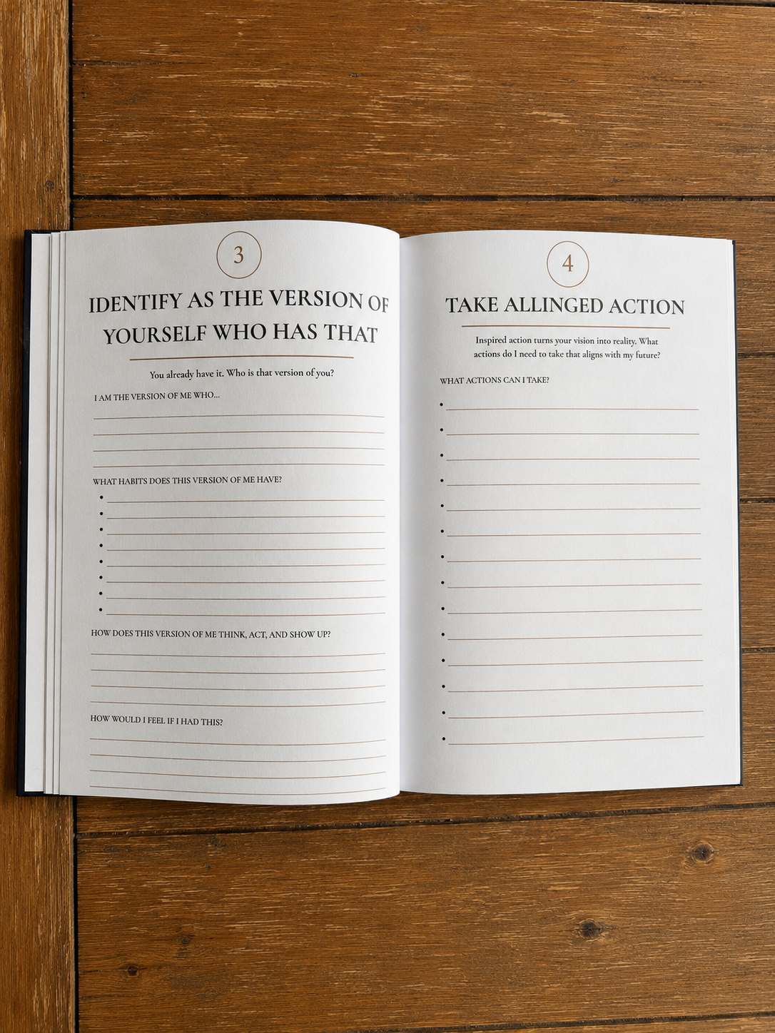 Open journal on a wooden table with pages titled 'Identify as the version of yourself who has that' and 'Take aligned action,' containing prompts for self-reflection and goal setting.