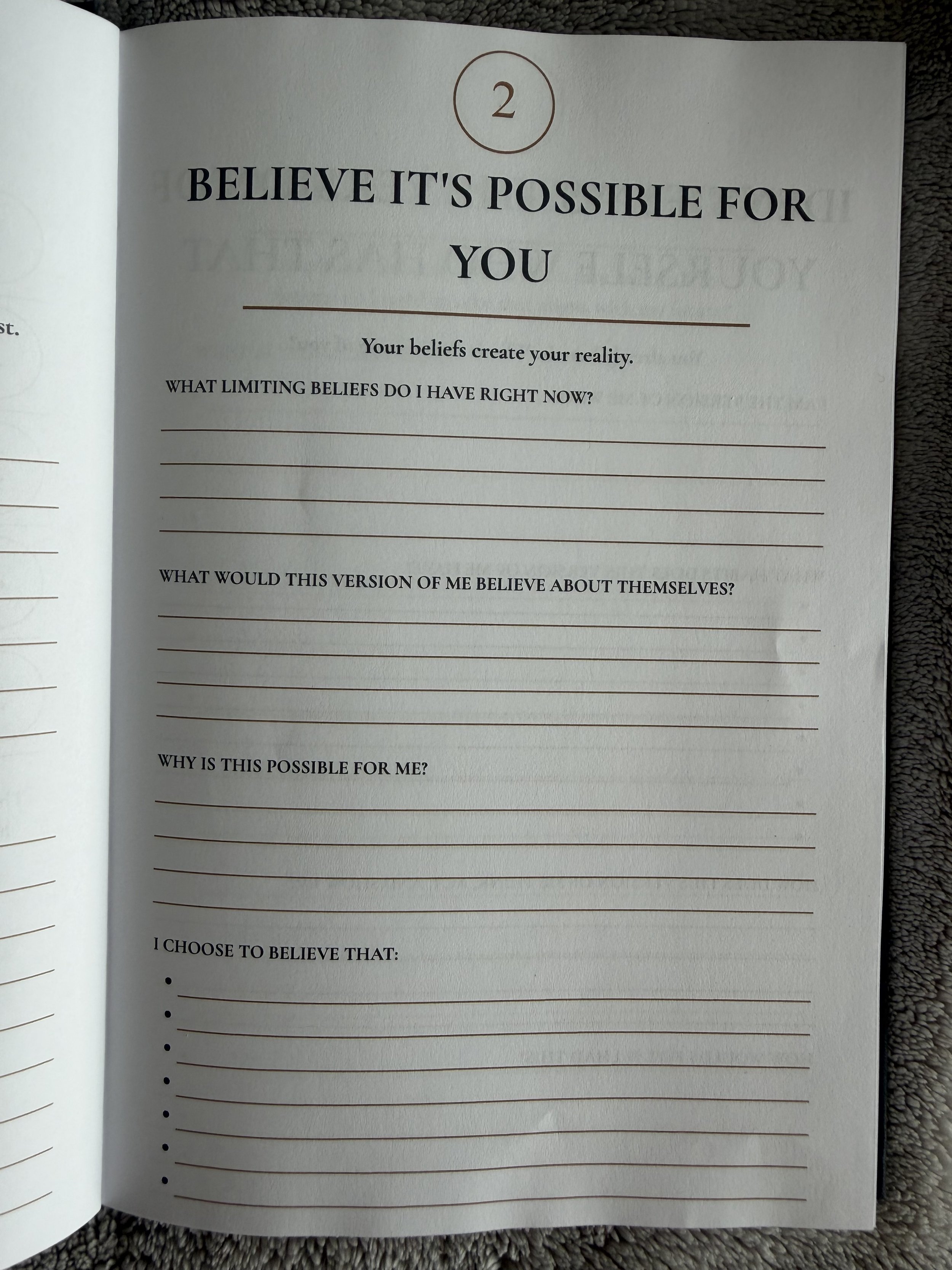 Open journal page with the number 2 in a circle at the top. The page features prompts for beliefs and self-reflection, including titles like "Believe it's possible for you," "Your beliefs create your reality," and questions about limiting beliefs and self-perception.