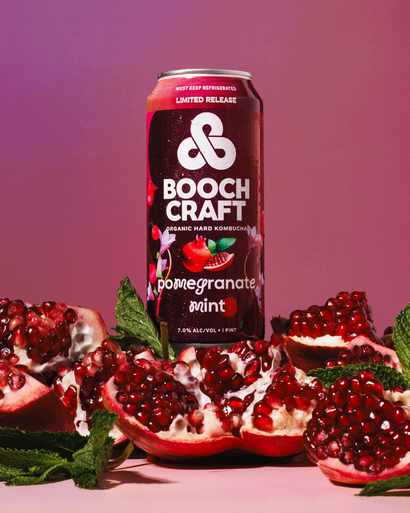 Commercial beverage GIF of a spinning can of Boochcraft surrounded by pomegranates and mint.