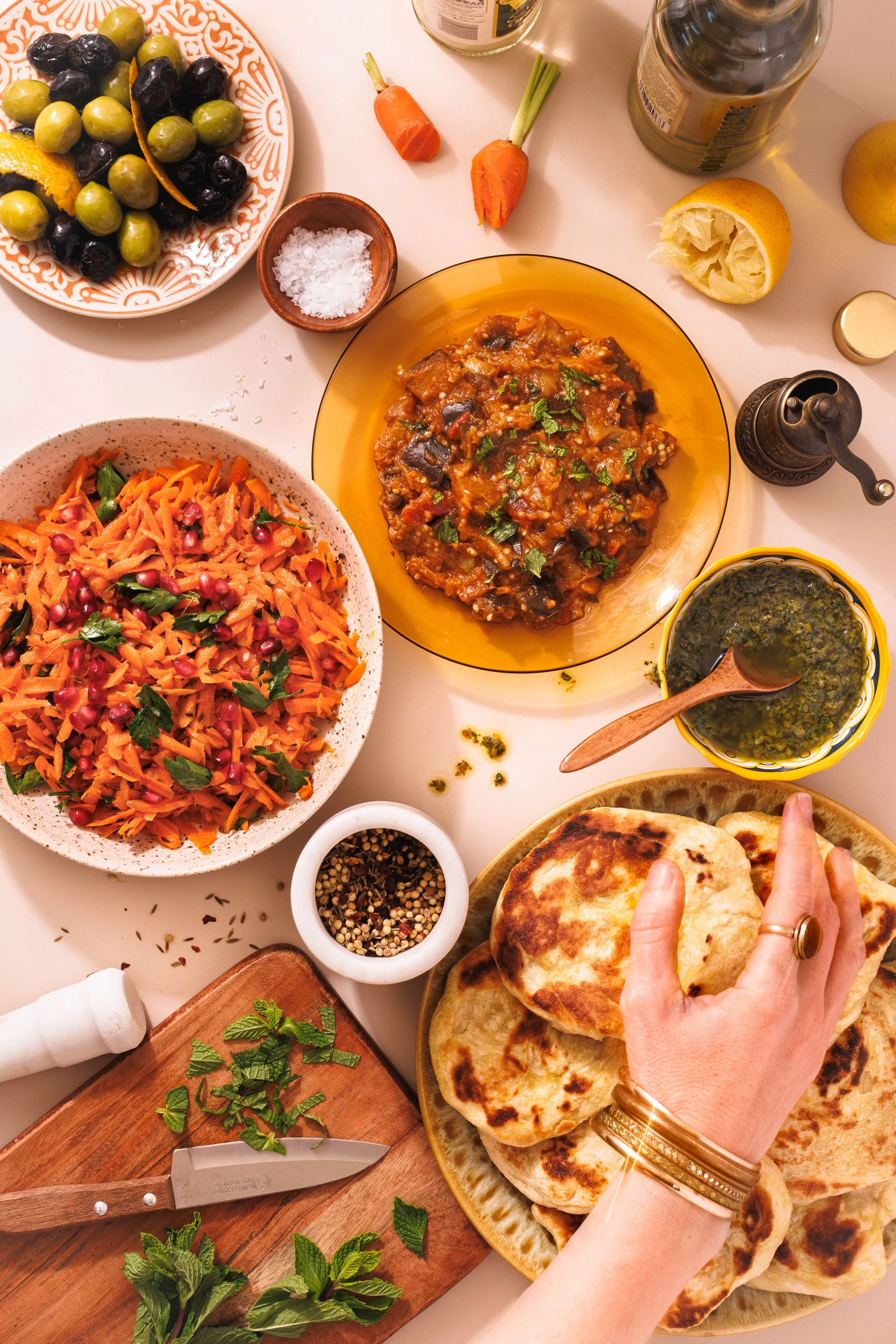 Editorial food photography flat lay of Moroccan dishes for a cookbook.