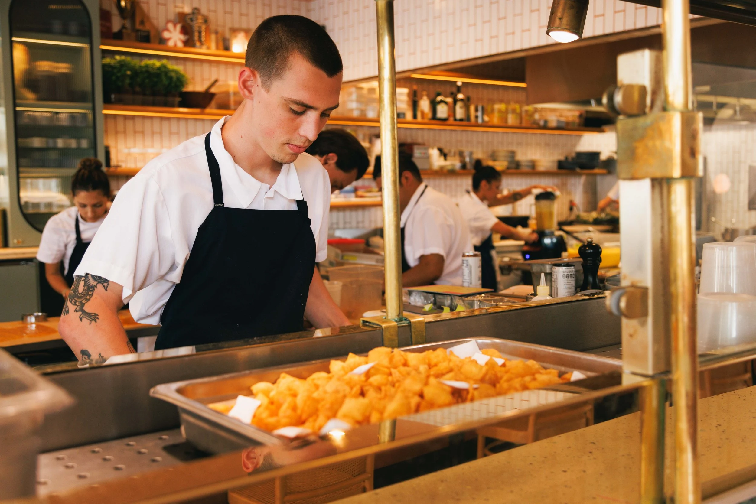 Hospitality photo of restaurant staff and chefs working.