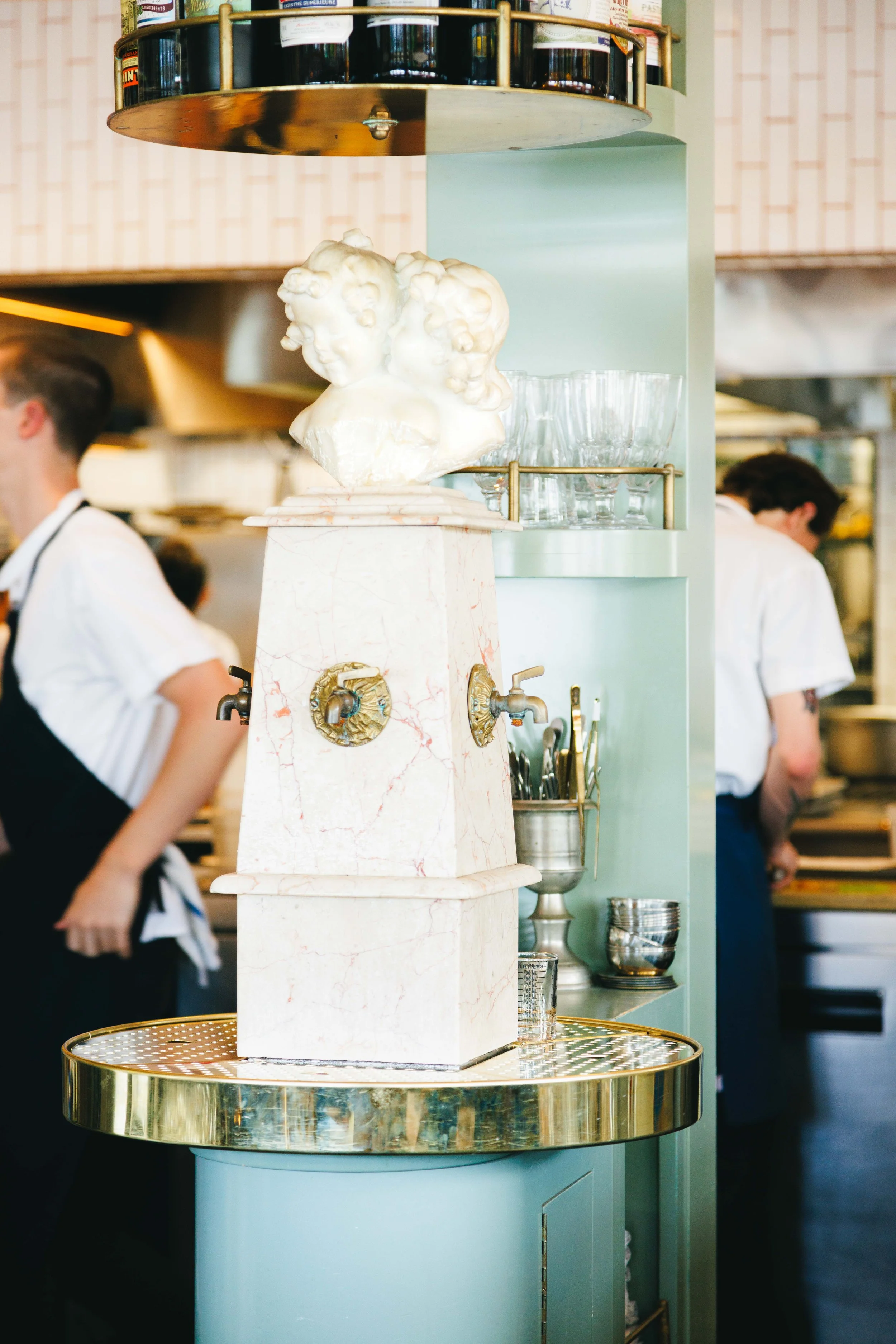 Hospitality interiors photo of an absinthe fountain in a fine dining establishment.