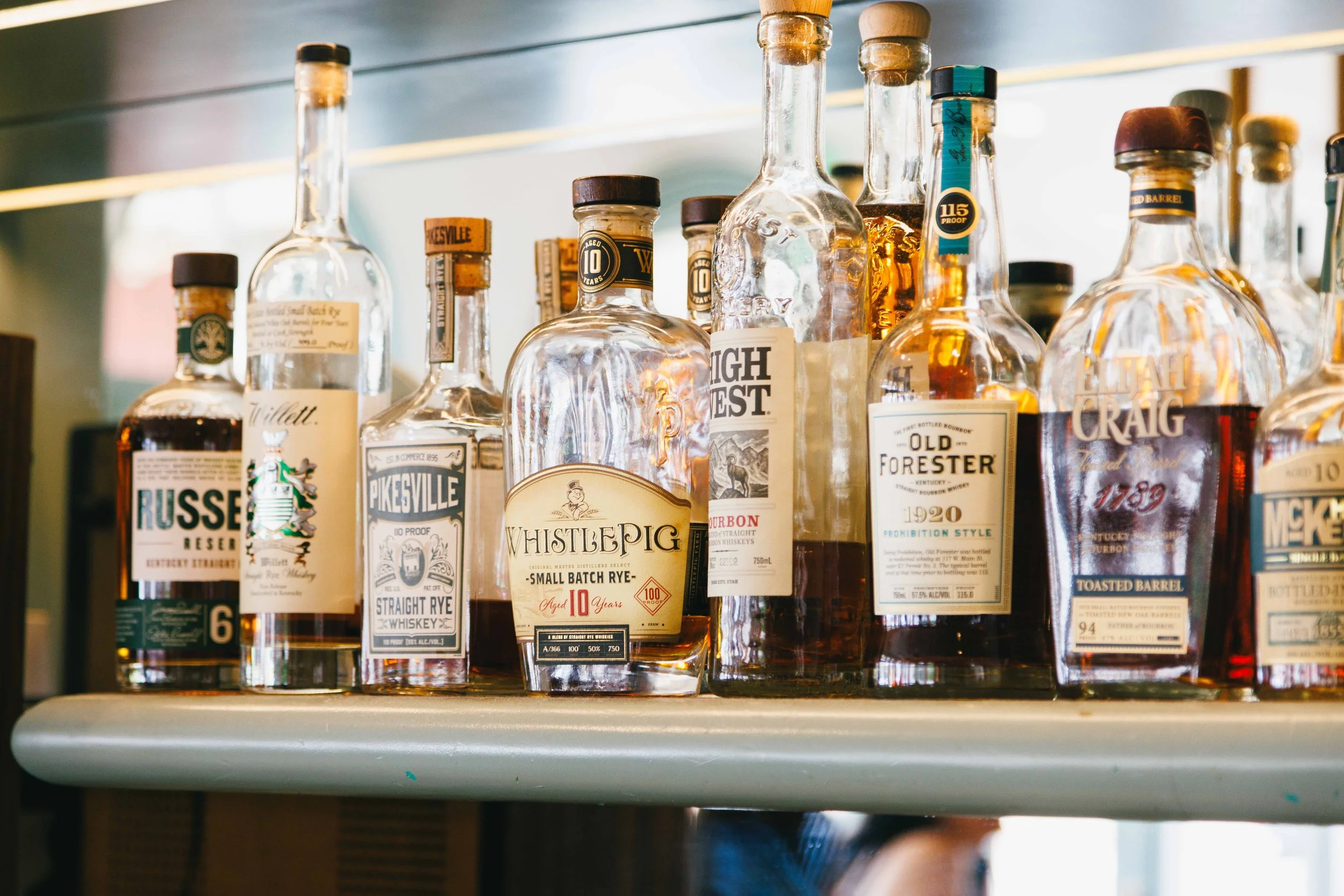 Hospitality photo of liquor shelf at the bar of an elegant restaurant.