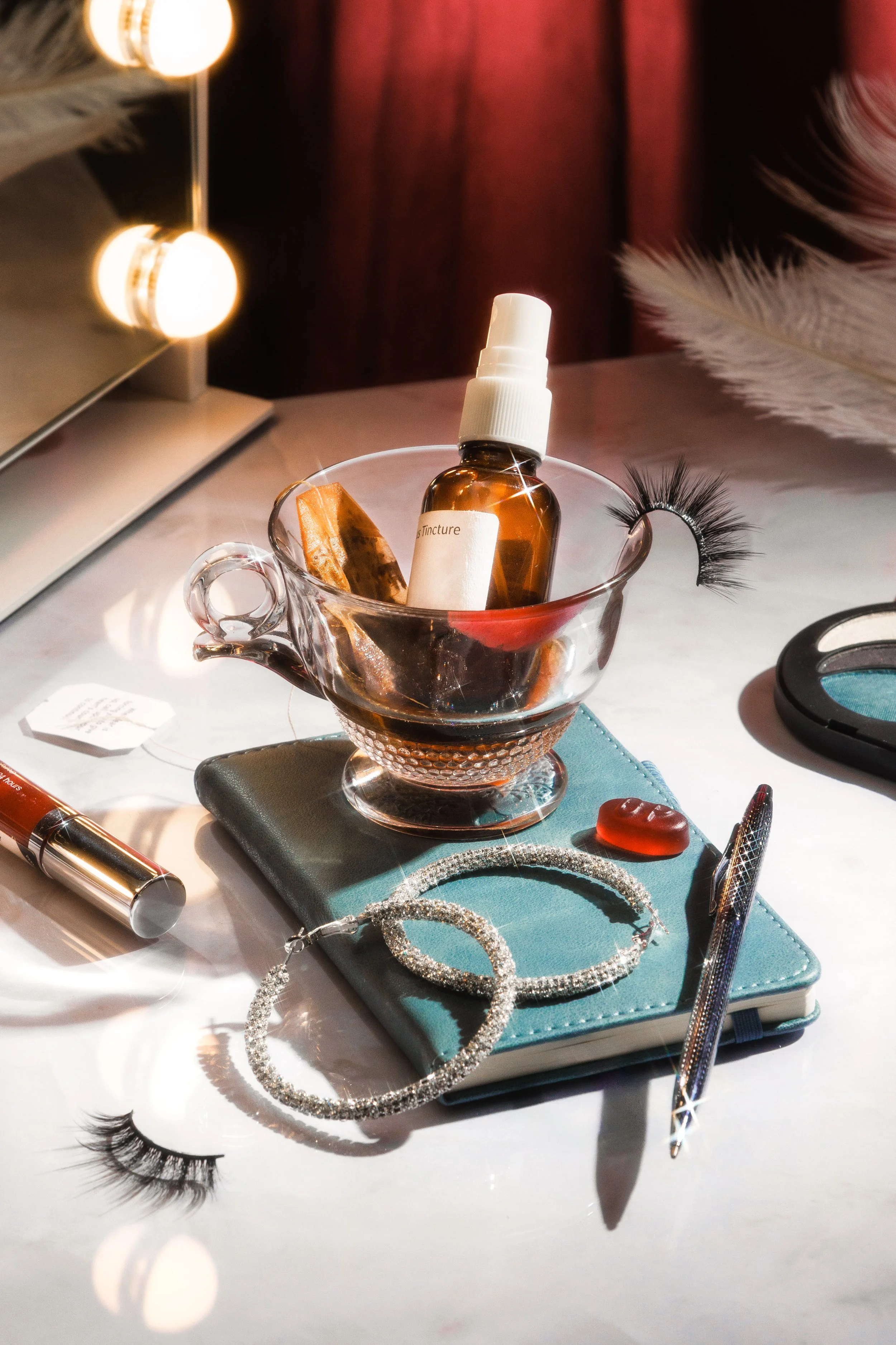 Stylized commercial still life photo of cosmetics and jewelry for a conceptual beauty campaign.