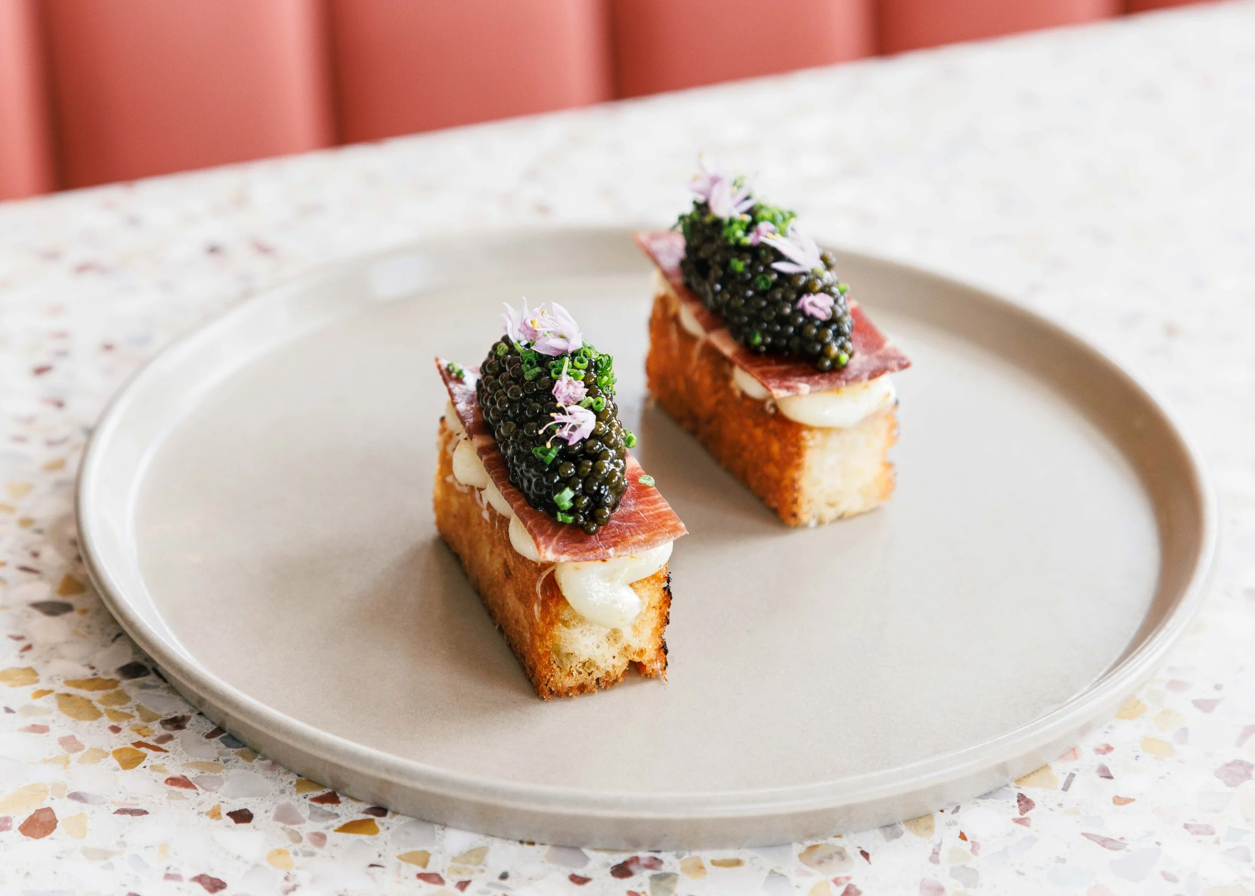 Editorial hospitality food photo of appetizers in a fine dining restaurant.