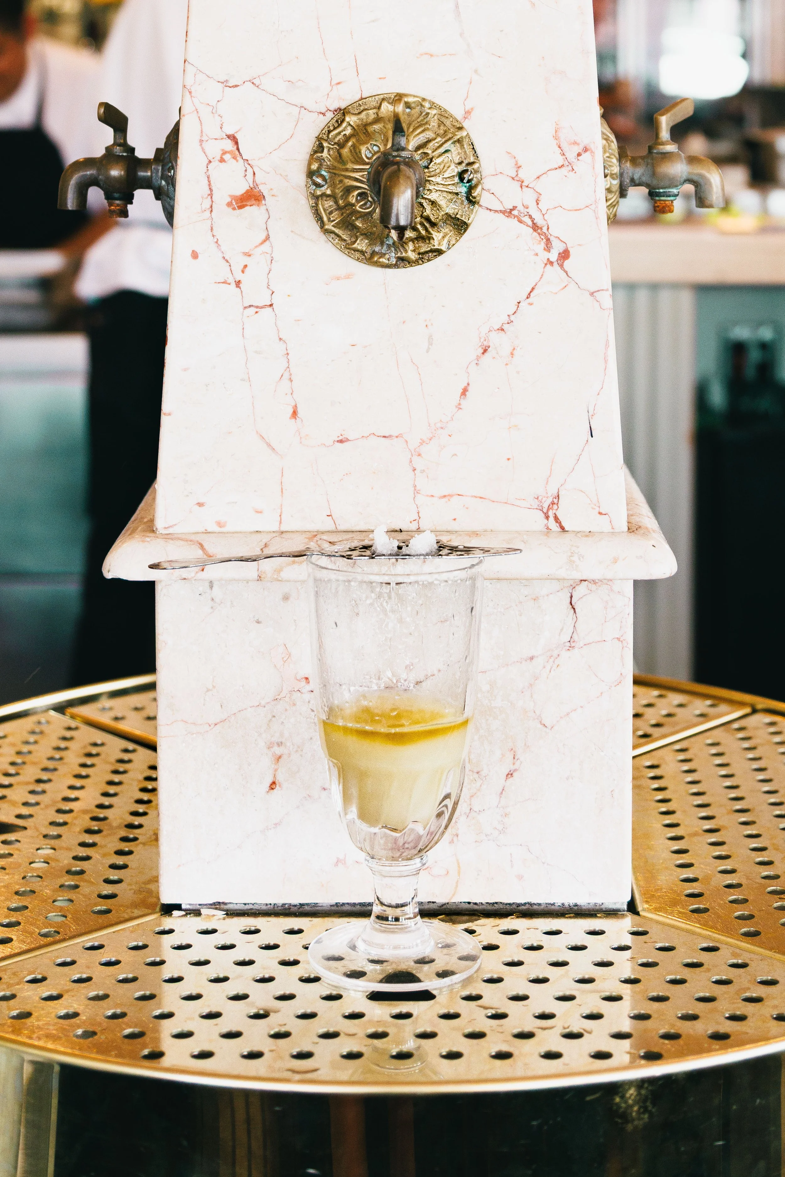 Editorial hospitality photo of an absinthe fountain.