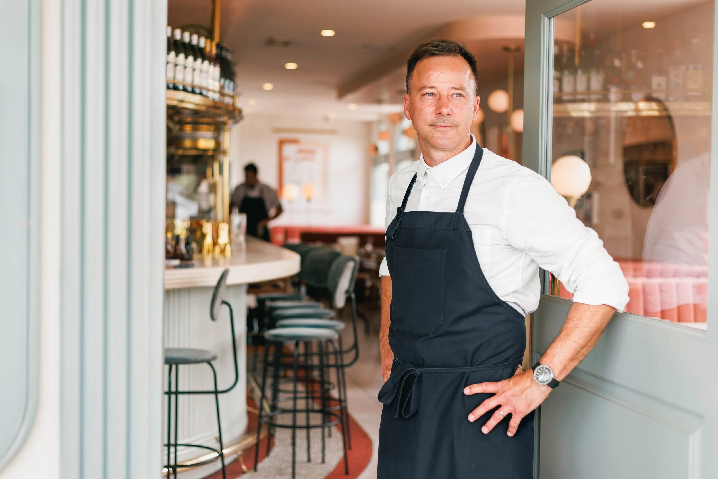 Editorial portrait of Chef Eric Boost in front of his restaurant Jeune et Jolie, shot by photographer Amy Carson for the LA Times.