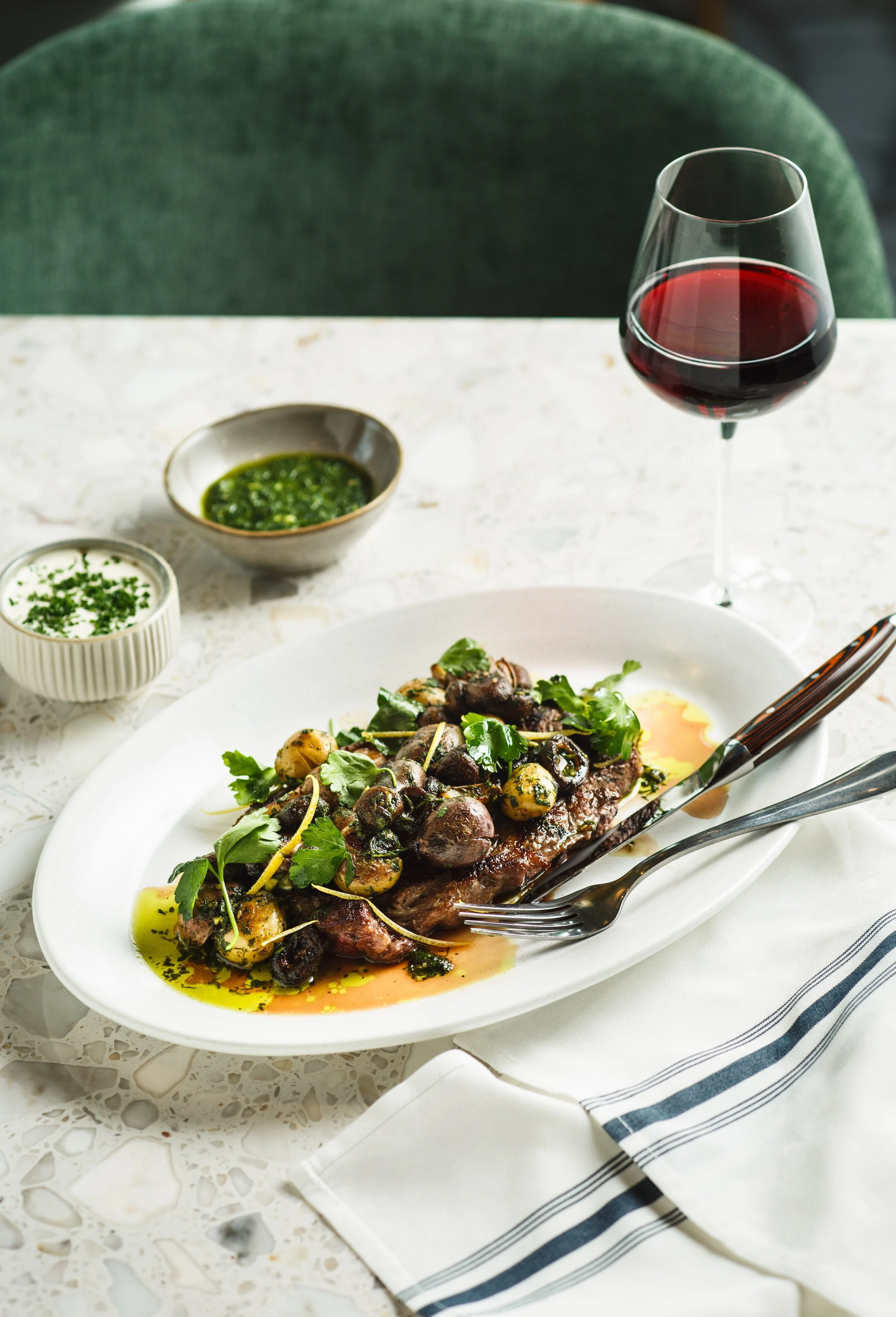 Commercial food photo of steak and potatoes for a restaurant advertisement.