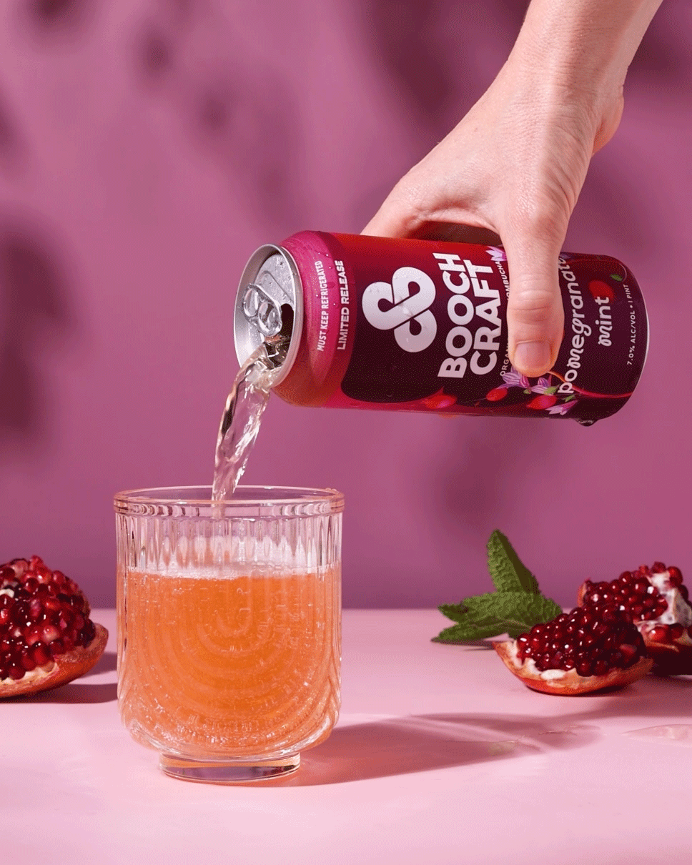 Commercial beverage cinemagraph of a hand pouring a can of Boochcraft kombucha into a glass for a campaign.