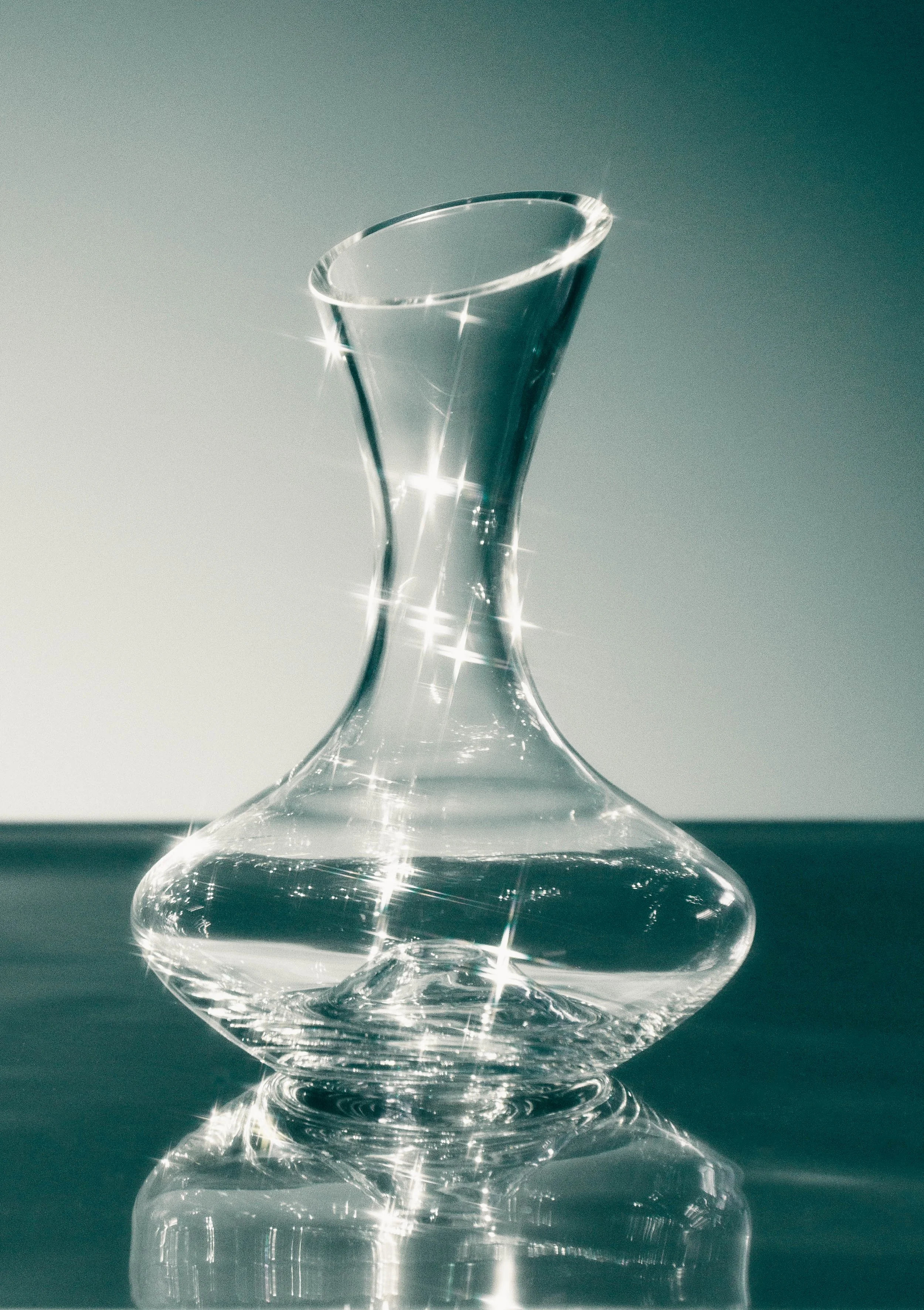 Conceptual still life photo of a glass vase with lots of sparkle for an editorial project.