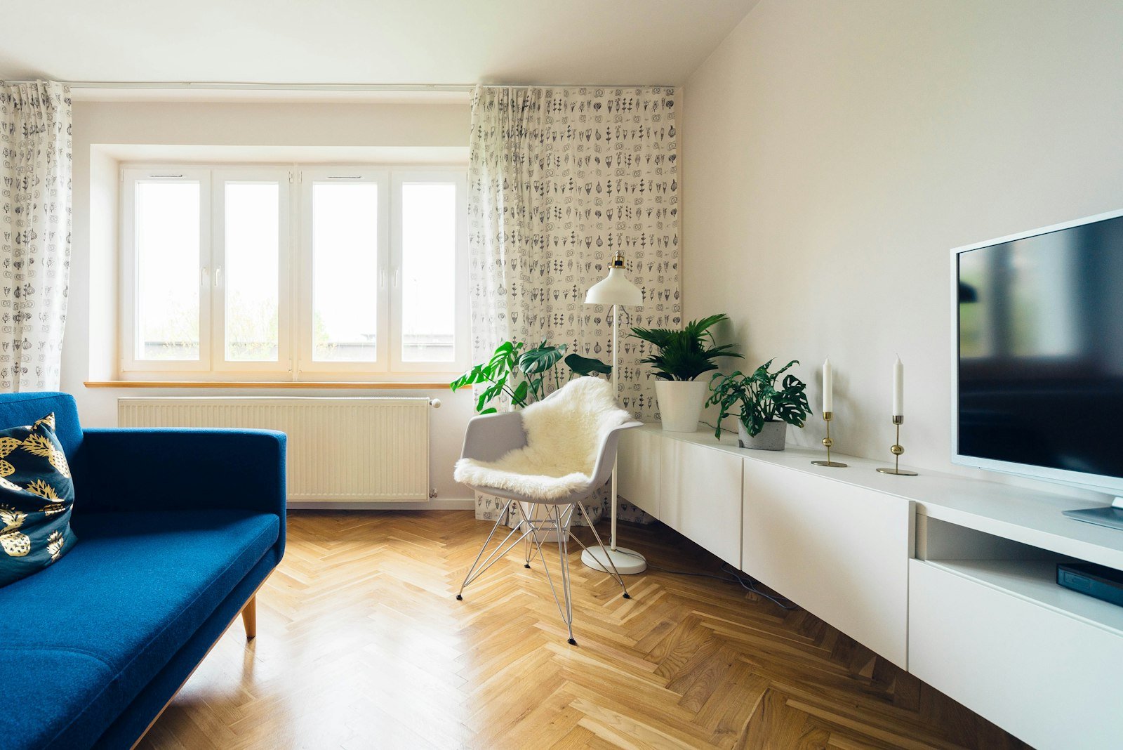 Bright living room with refreshed flooring and paint in a turned rental unit