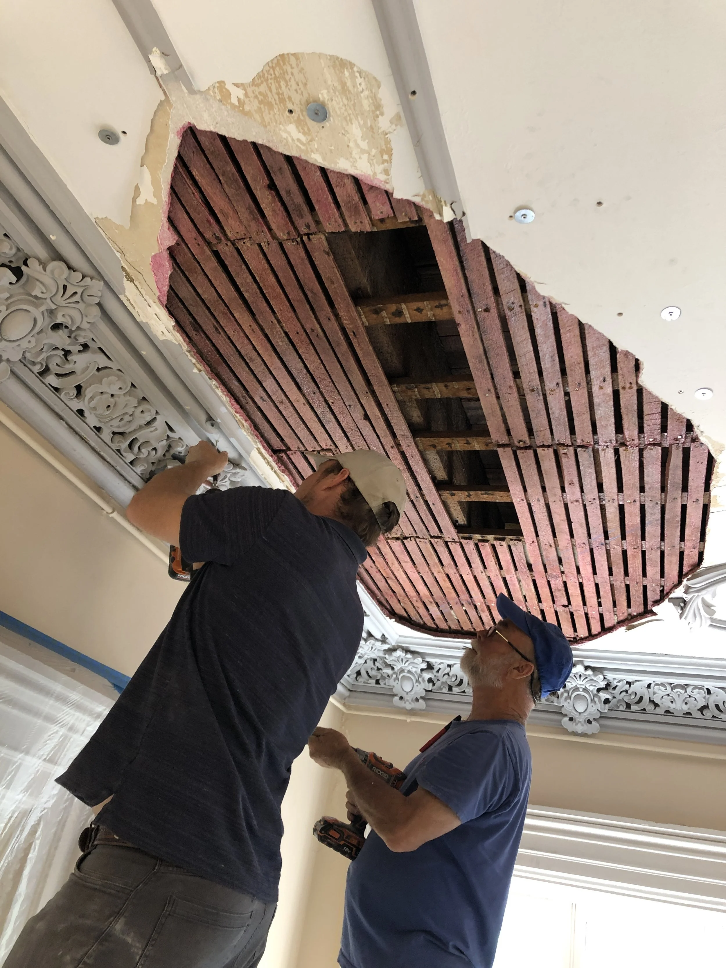 John Ecker and Fred Ecker restoring plaster on Jones Street in Savannah GA.
