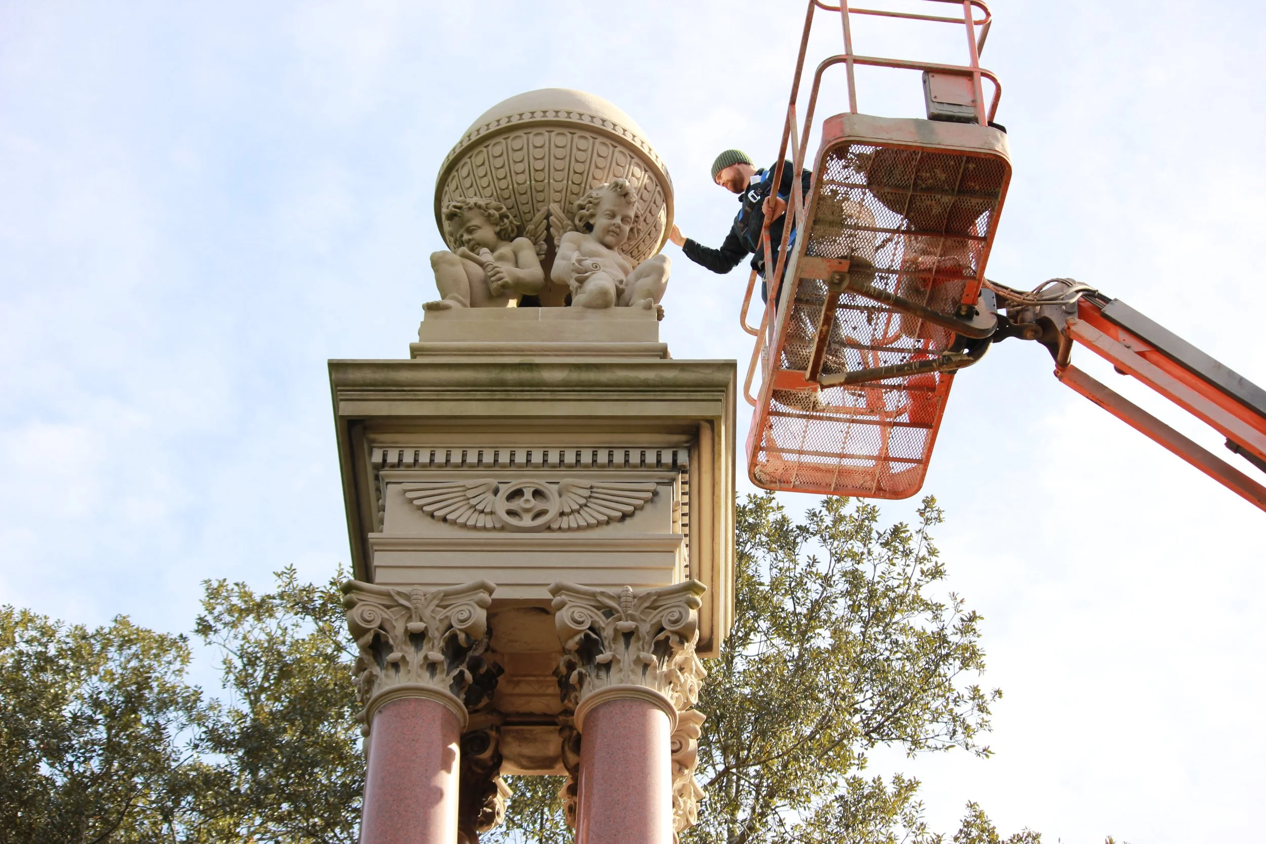 John Ecker on a lift inspecting Historic Gordon Monument in Savannah, GA.