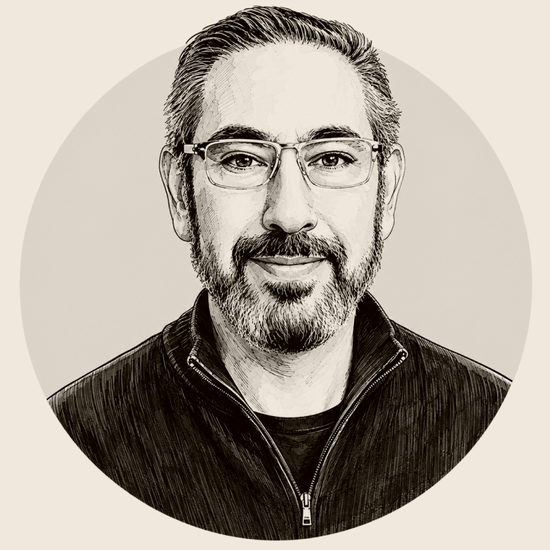 A black-and-white illustrated portrait of a smiling man with glasses, a beard, and short hair, wearing a dark zip-up jacket.