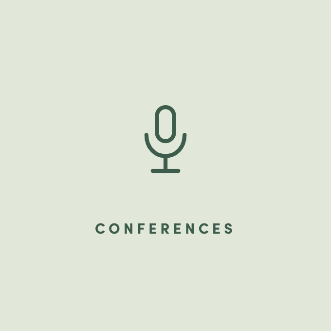 Icon of a microphone above the word 'Conferences' on a light green background.