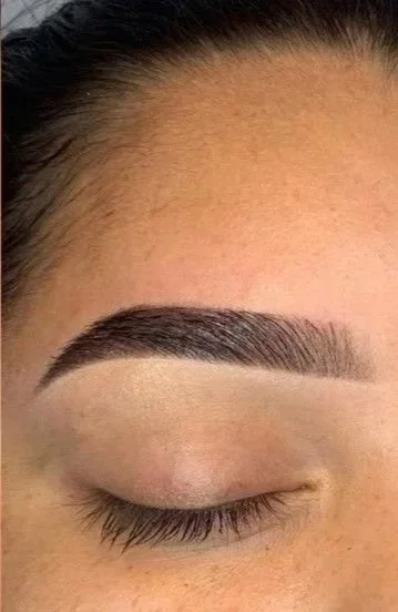 Soft natural eyebrow tattoo with powder brow permanent makeup result