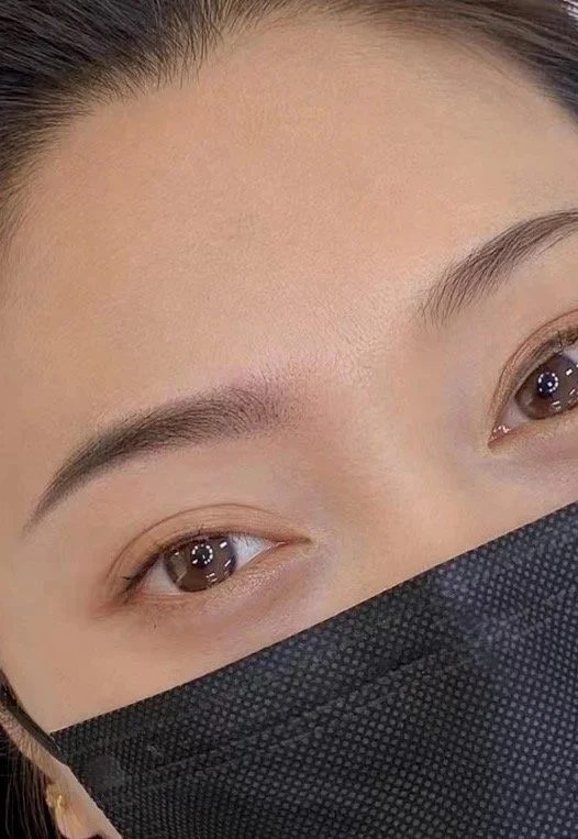 Natural eyebrow tattoo designed to enhance facial features