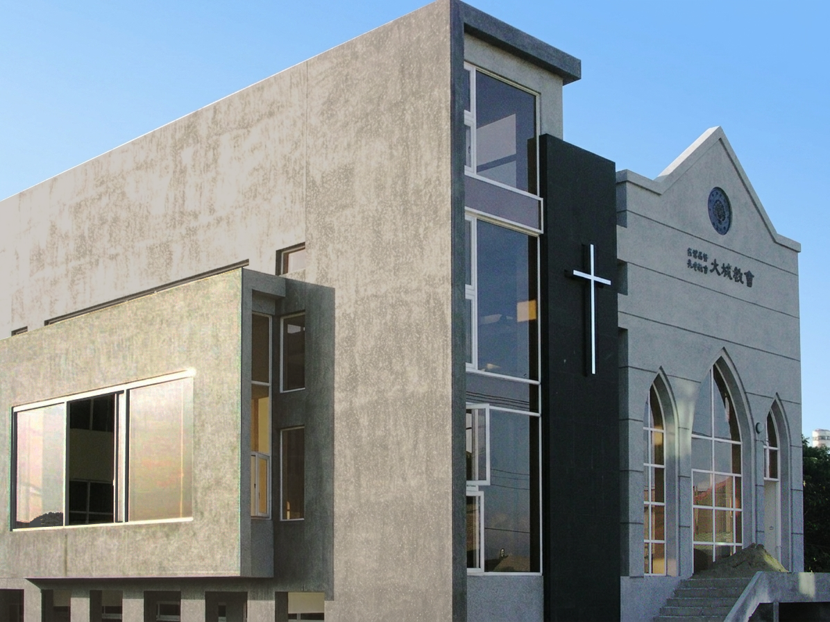 Modern church building with large windows, a cross on a black vertical panel, and Japanese writing on the facade, against a clear blue sky.