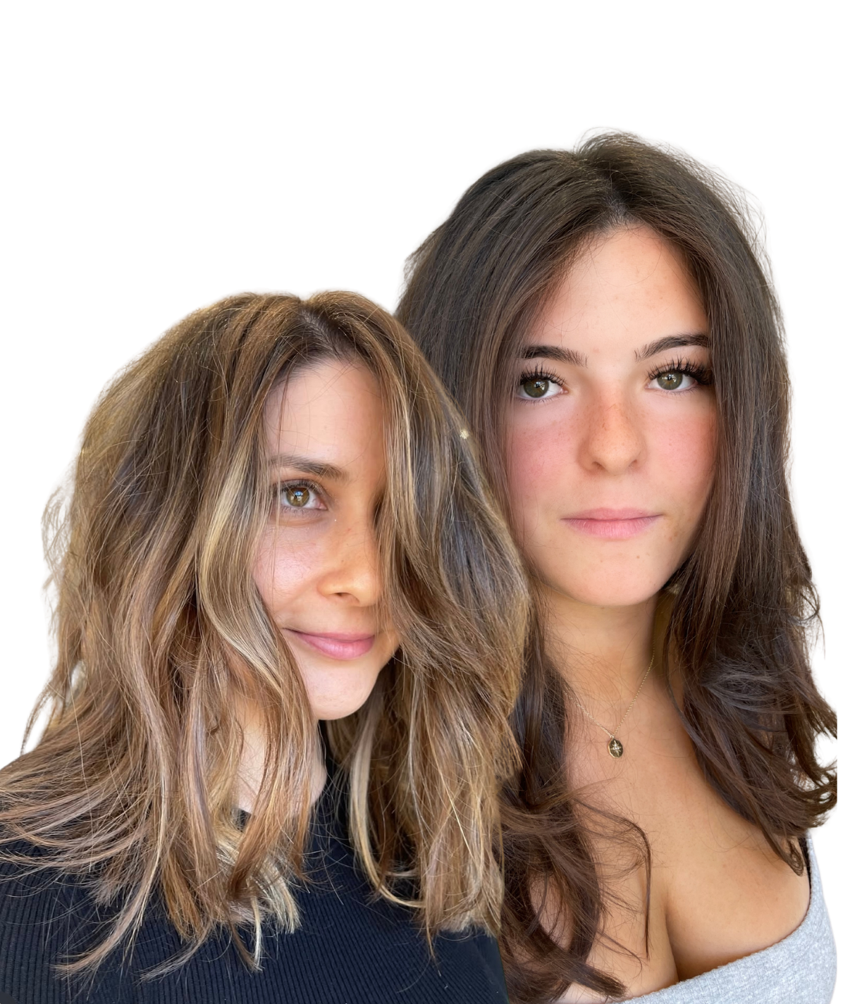 Two women with long, wavy hair looking at the camera, one with light brown hair and the other with dark brown hair, against a plain background.