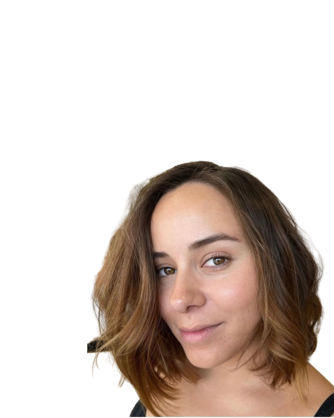 Close-up of a woman with shoulder-length wavy brown hair, light skin, and brown eyes, smiling softly at the camera.