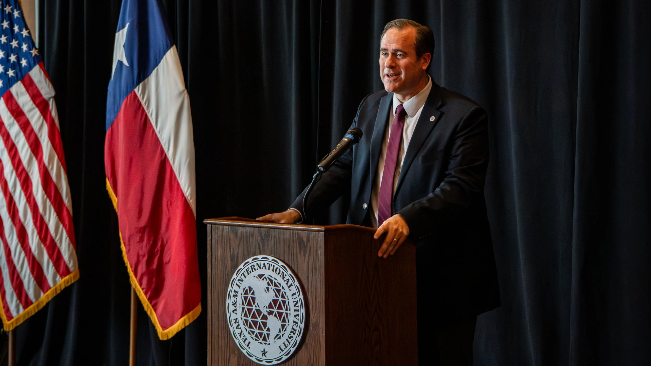 The University President delivering Opening Remarks to open the event.
