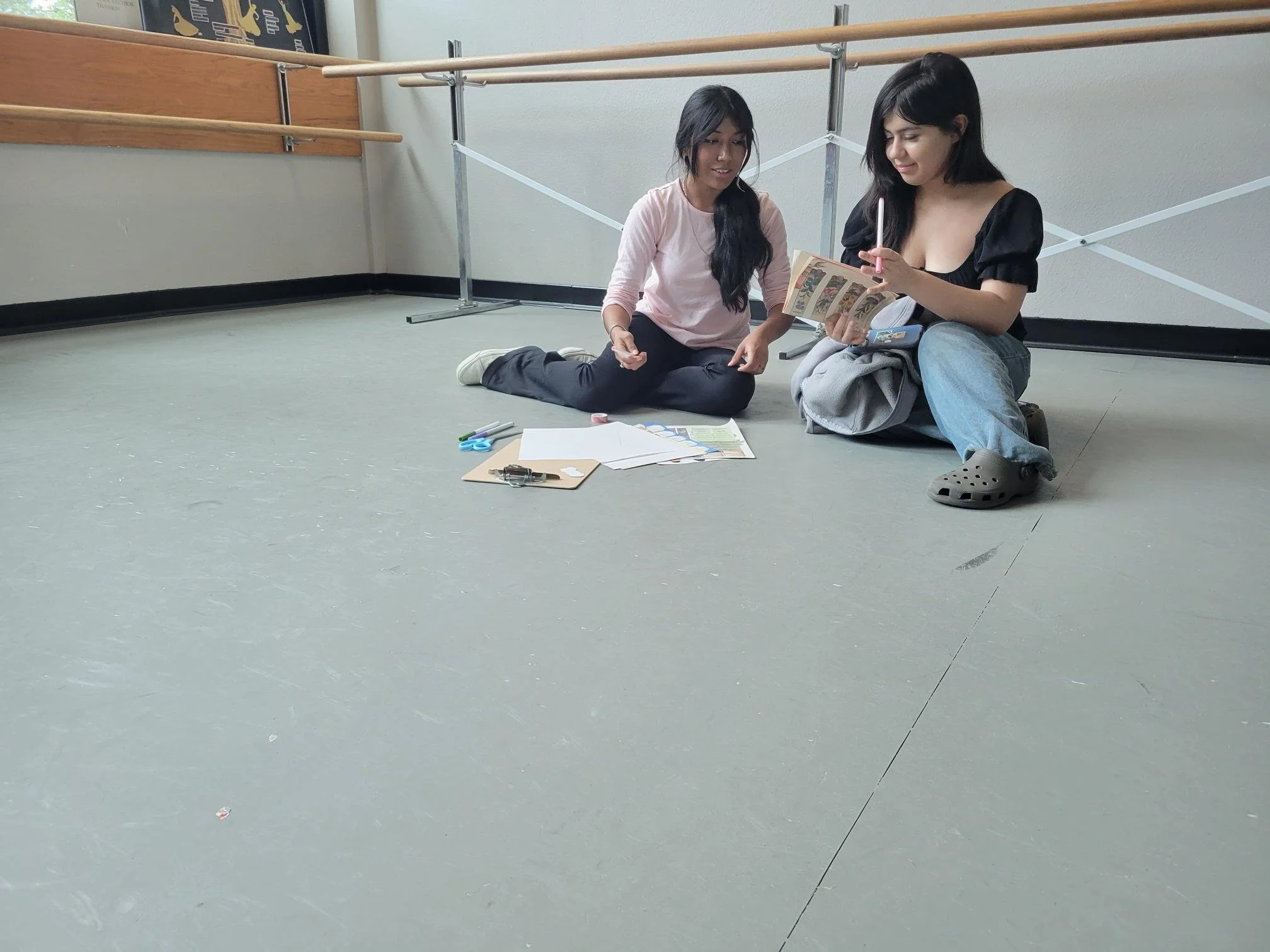 Students working together to work on their personalized books during the event activity.