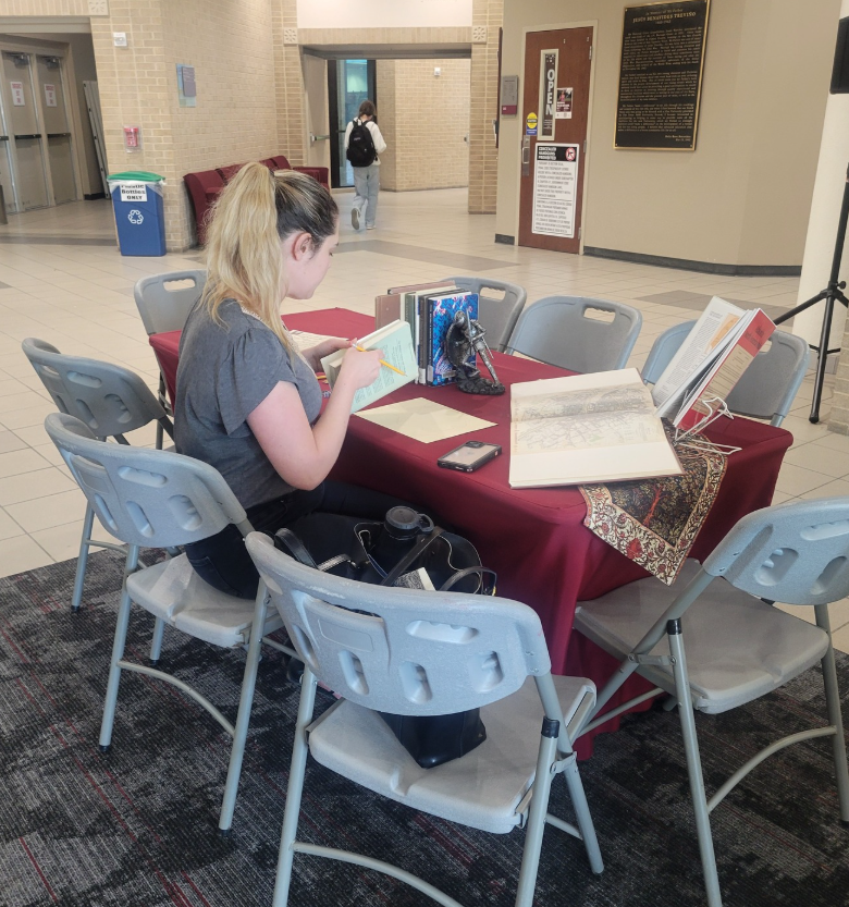 A faculty member engaging with the materials and participating in the event.