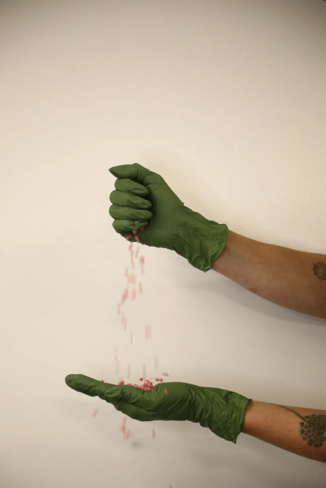 wax beads falling and catching