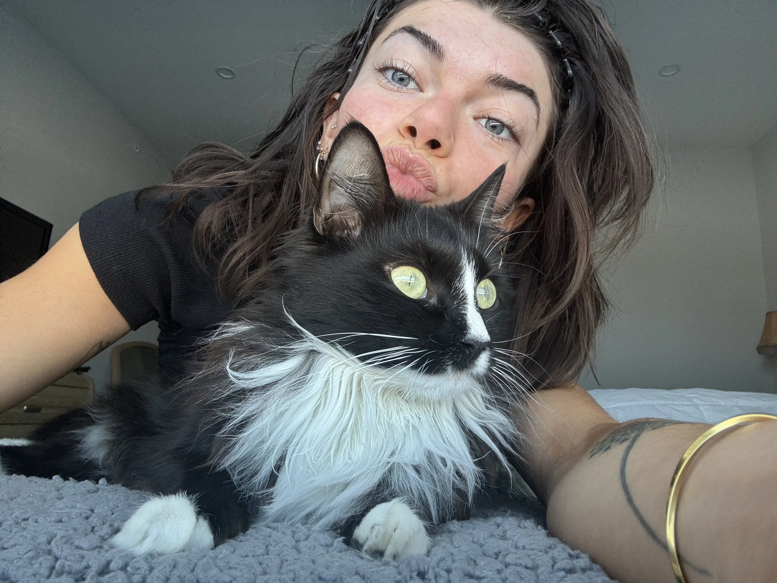 Girl posing with cat.