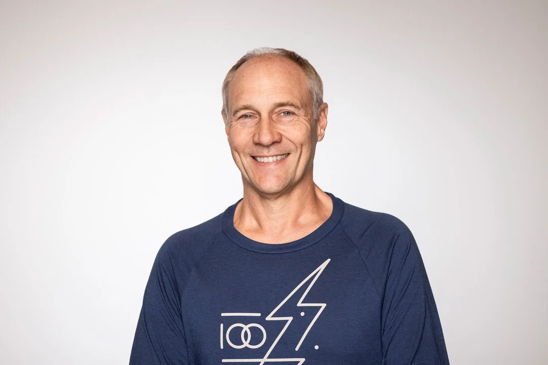 Steve, founder and principal consultant at Searchlight – Auckland's leading IT networking consultancy, a smiling man with short hair, wearing a navy blue shirt, standing against a plain white background.