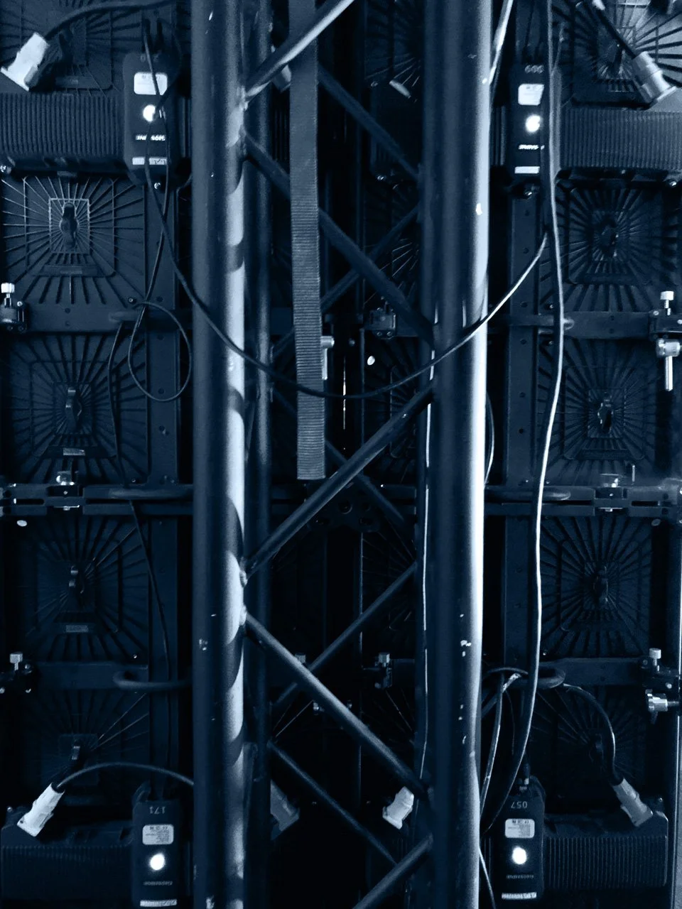 Close-up view of mounted LED screens or digital displays connected with cables, experienced business network solutions Auckland New Zealand