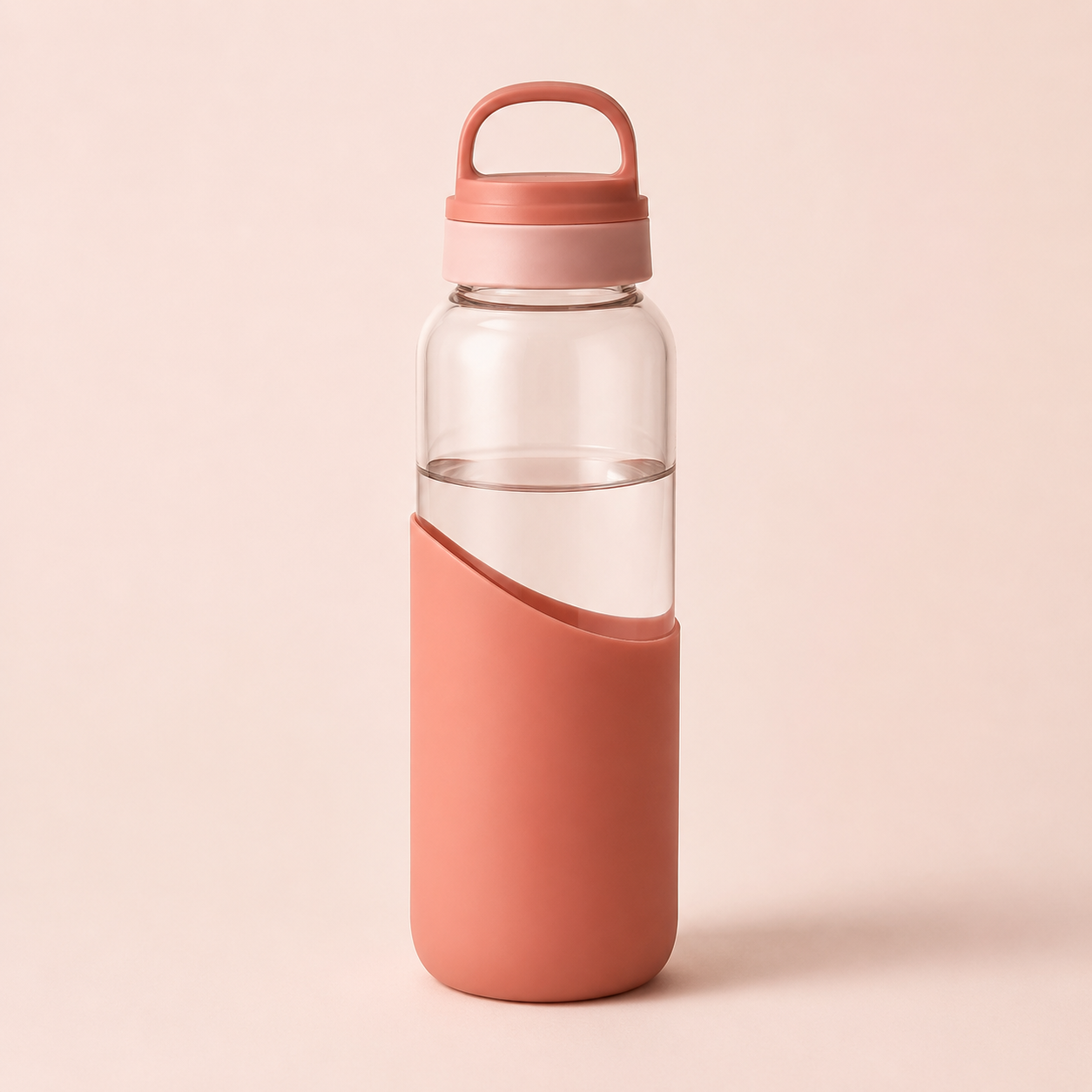 A pink and clear water bottle with a pink cap and pink sleeve, filled with water, on a light pink background.