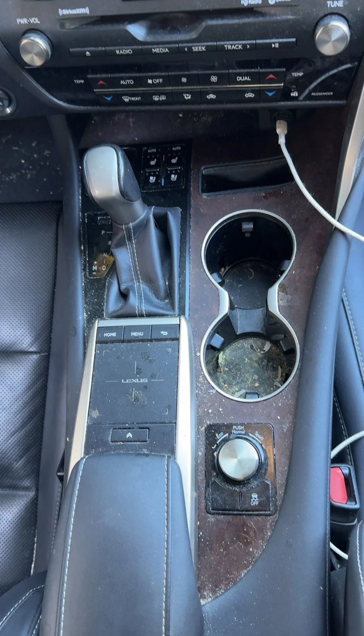 Lexus center console before an Complete Detail