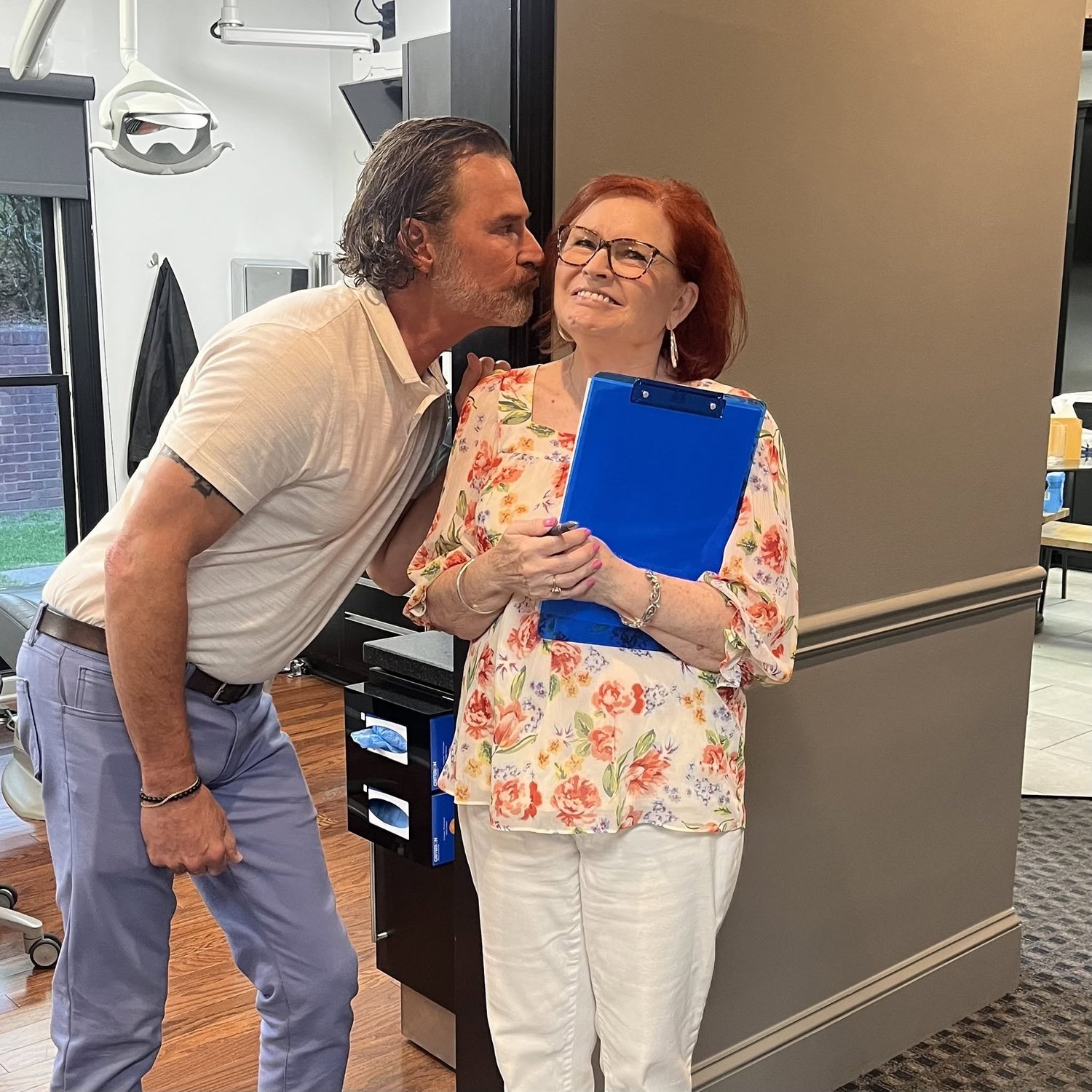 Dr. Ray Morgan sharing a warm moment with a longtime patient