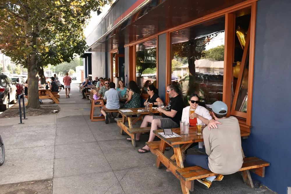 Guests enjoying outdoor dining at a Woodstock café