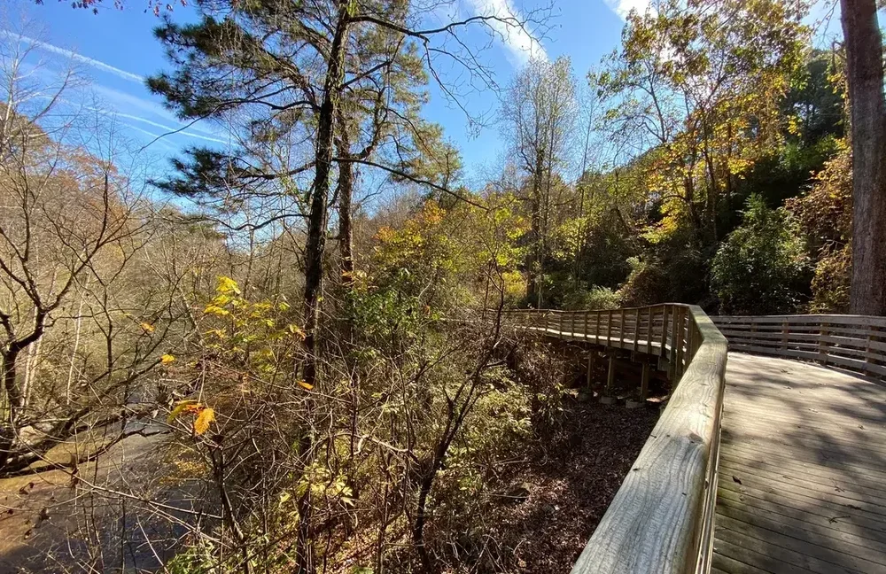 Wooden boardwalk beside Noonday Creek in Woodstock