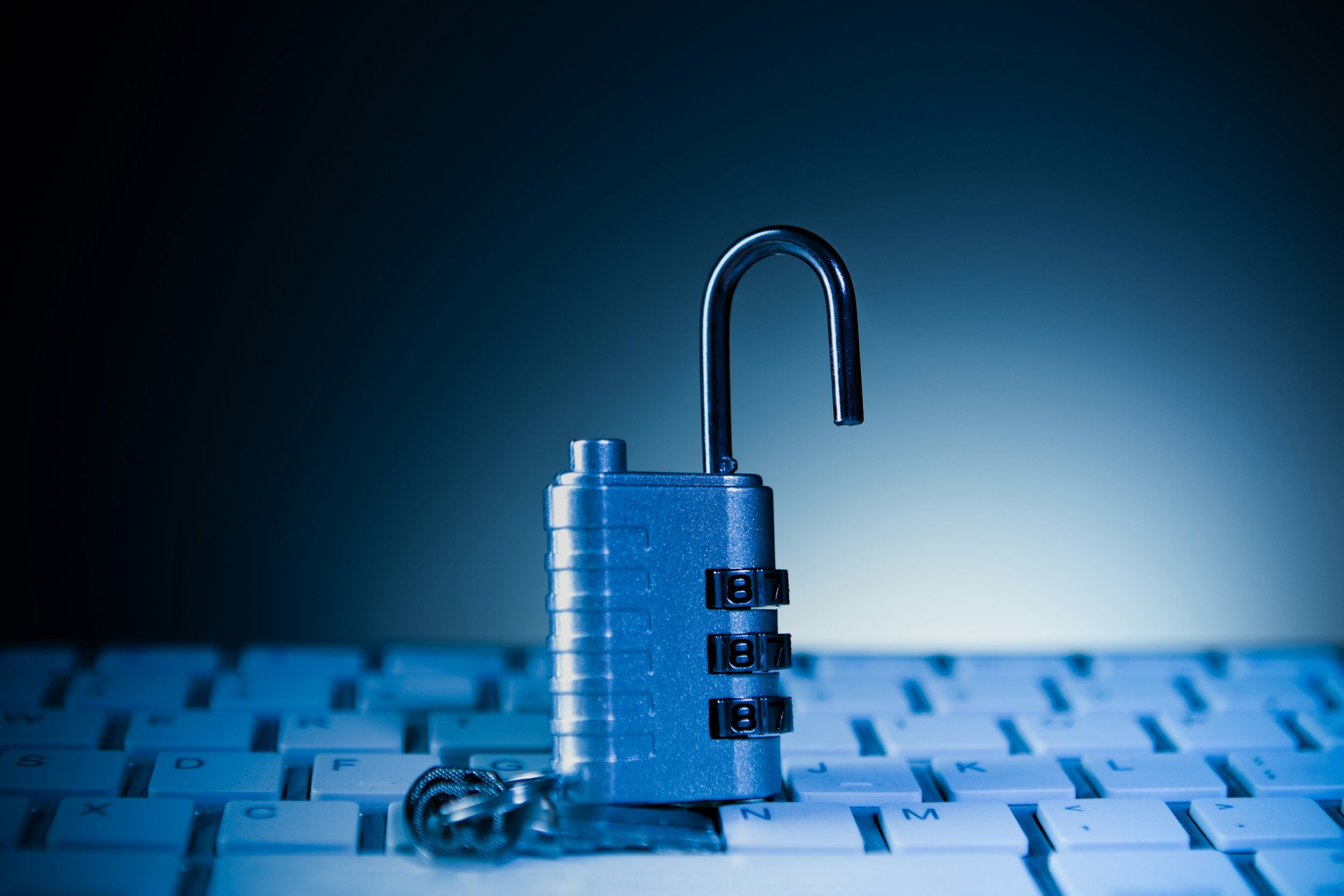 Close-up of a lock with the number 87 on a computer keyboard, symbolizing cybersecurity or data protection.