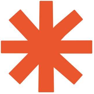 An orange asterisk symbol on a black background.